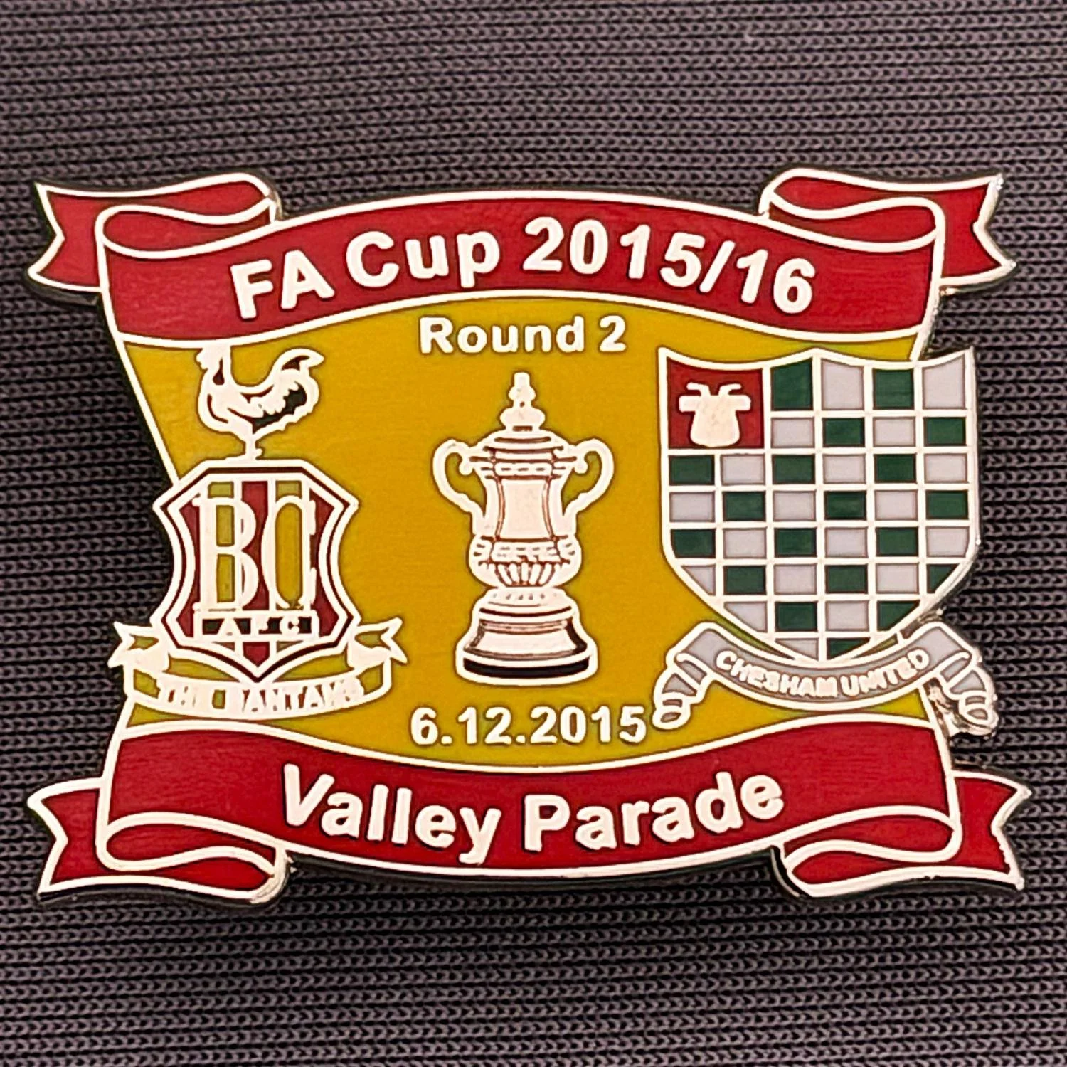 Reference Number: BCFAC141
Size: H 24.5 mm x W 32.5 mm
Pin Type: Metal Clutch
Plating: Silver
Value: £4
Manufacturer: Dan Lloyd
Comments: F.A. Cup Second Round 2015/16 v Chesham United, Red & Amber Version