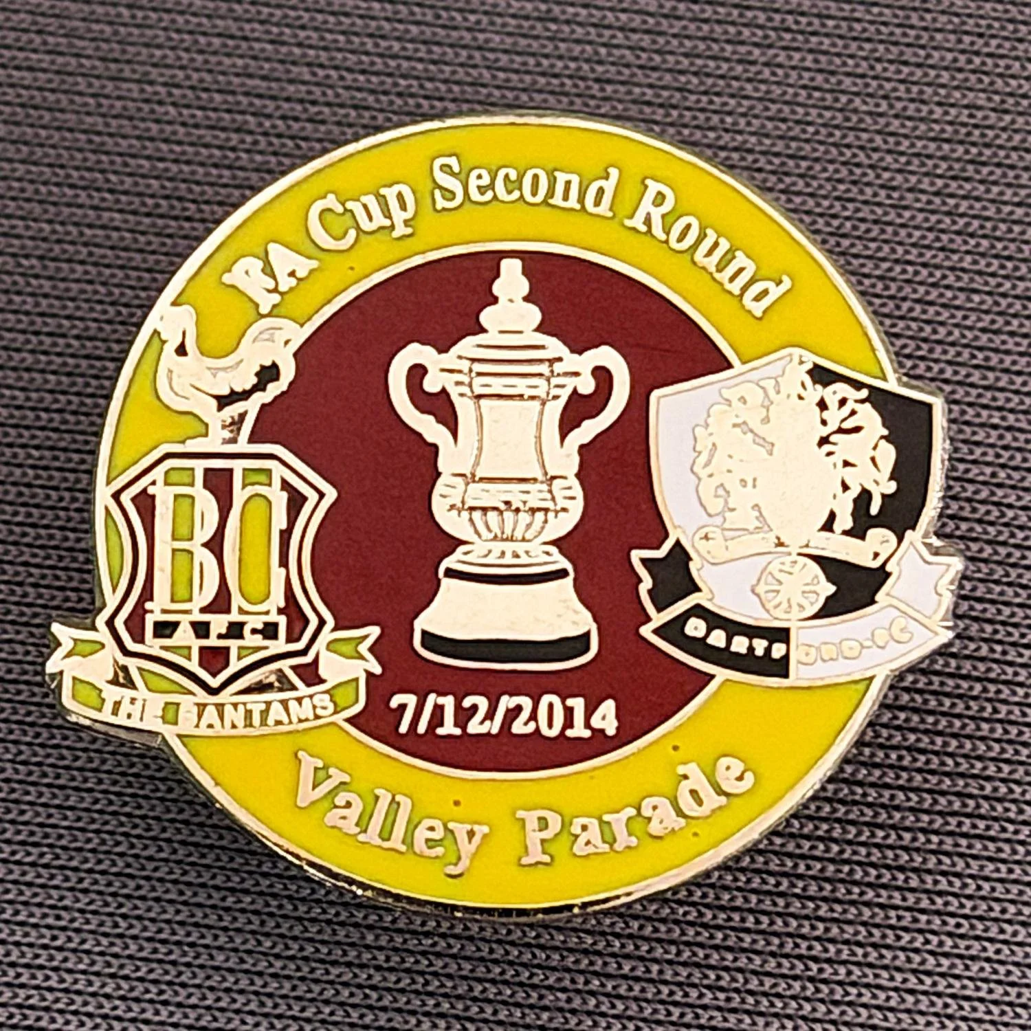 Reference Number: BCFAC064
Size: H 23.3 mm x W 25.6 mm
Pin Type: Metal Clutch
Plating: Silver
Value: £4
Manufacturer: Dan Lloyd
Comments: F.A. Cup Second Round 2014/15, v Dartford, Amber & Claret Version