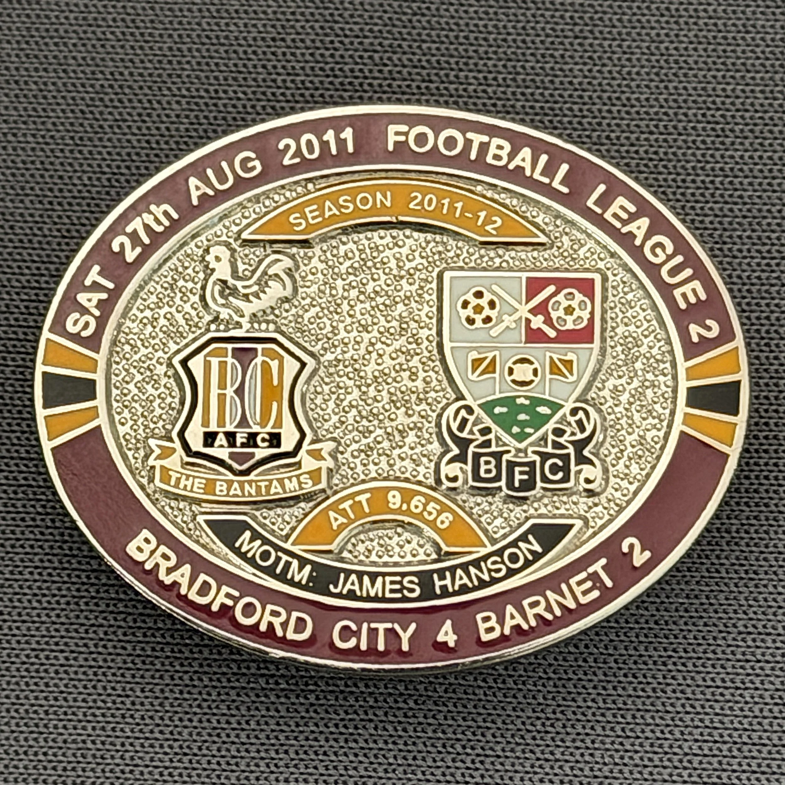 Reference Number: BCFIX095
Size: H 23.6 mm x W 28.7 mm
Pin Type: Brooch Pin
Plating: Silver
Value: £10
Manufacturer: Bradford City Badges
Comments: Bradford City v Barnet  2011/12 Limited Edition 20 Badges (Silver Version)