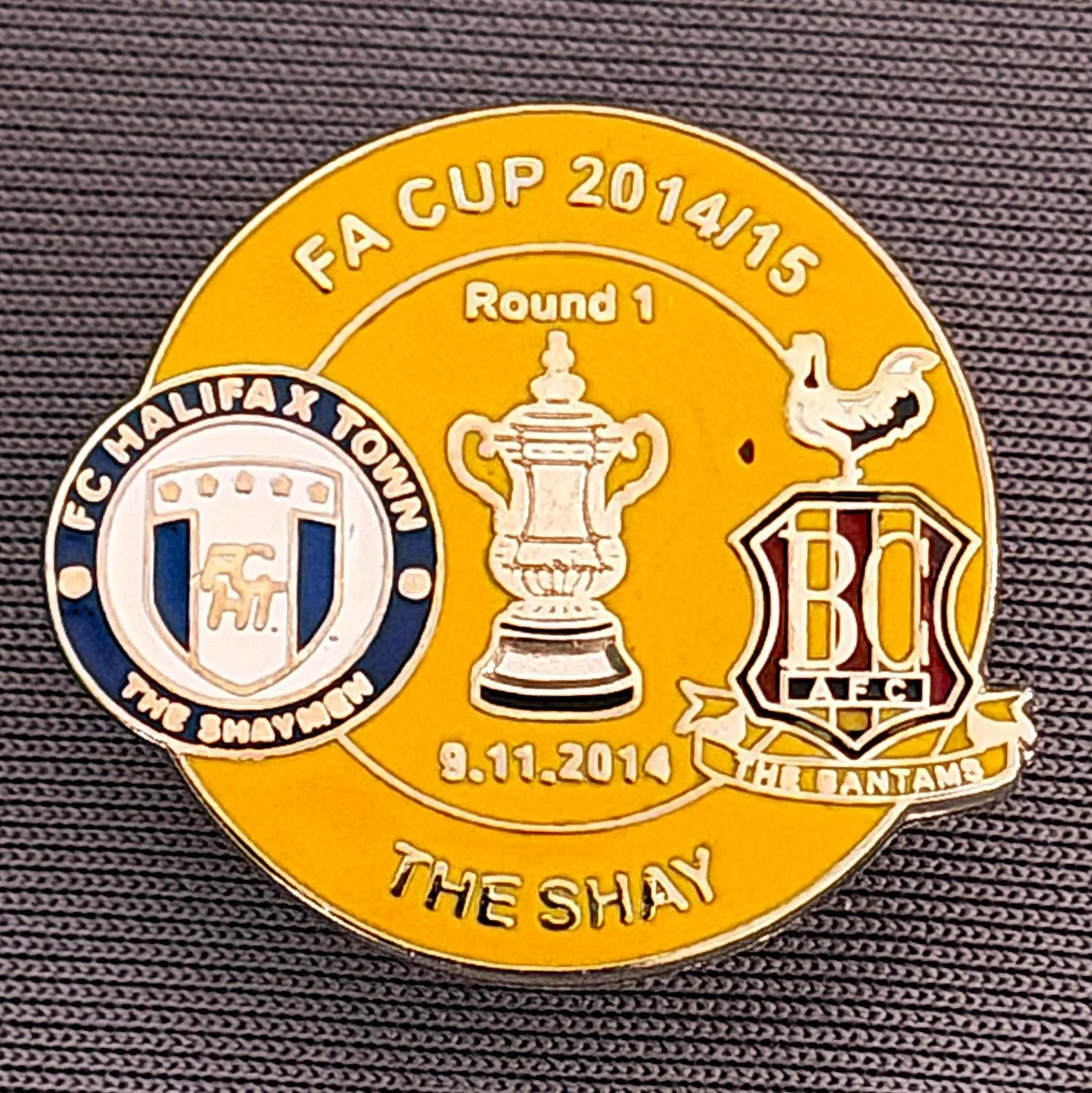 Reference Number: BCFAC053
Size: H 22. 7 mm x W 25.8 mm
Pin Type: Metal Clutch
Plating: Silver
Value: £4
Manufacturer: Dan Lloyd
Comments: F.A. Cup 2014/15 Away v Halifax Town, Amber Version