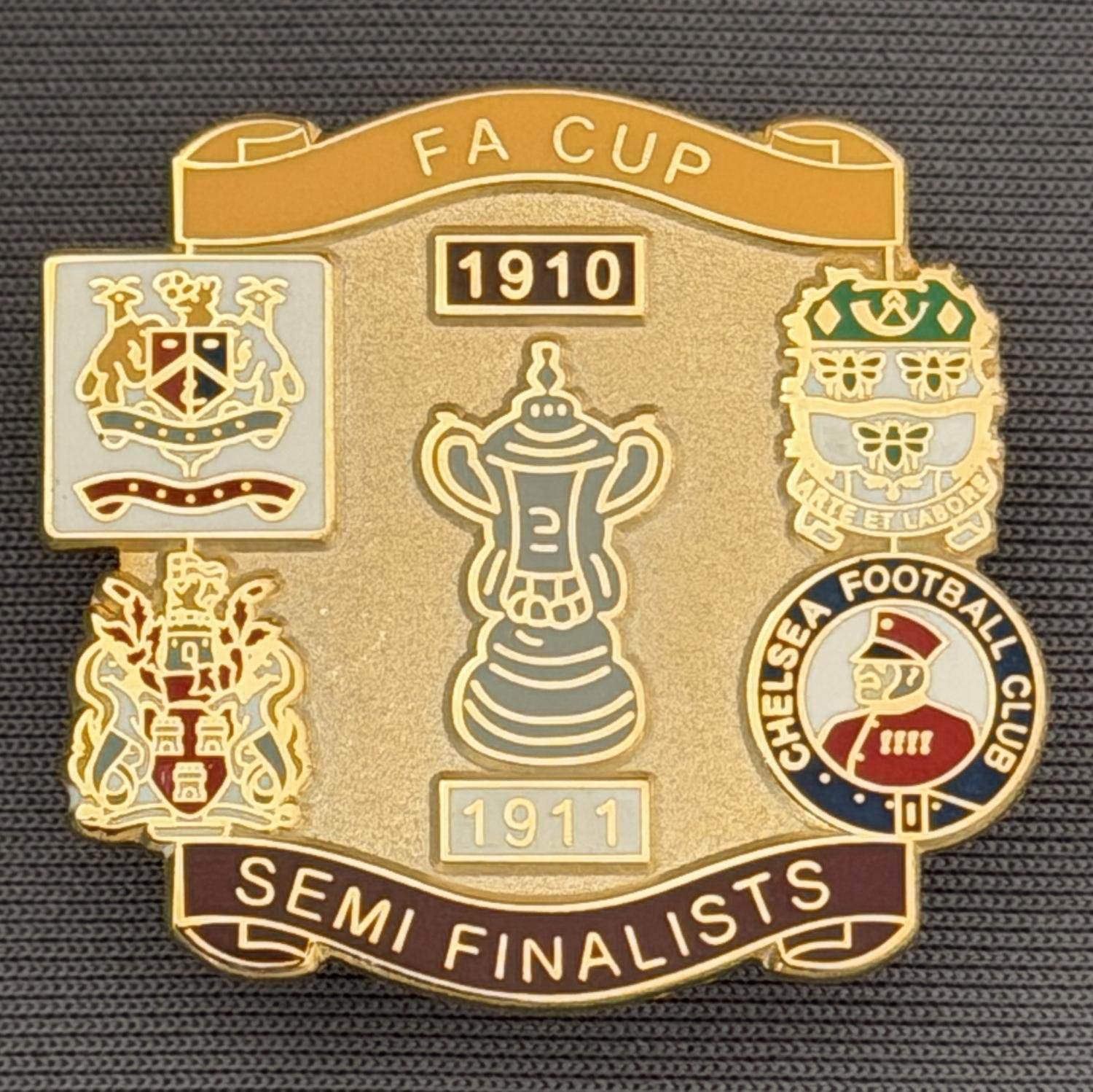 Reference Number: BCFAC030
Size: H 29.1 mm x W 31.3 mm
Pin Type: Brooch Pin
Plating: Gold
Value: £6
Manufacturer: Unknown
Comments: 1910-1911, F.A. Cup Semi Finalists Claret & Amber Version