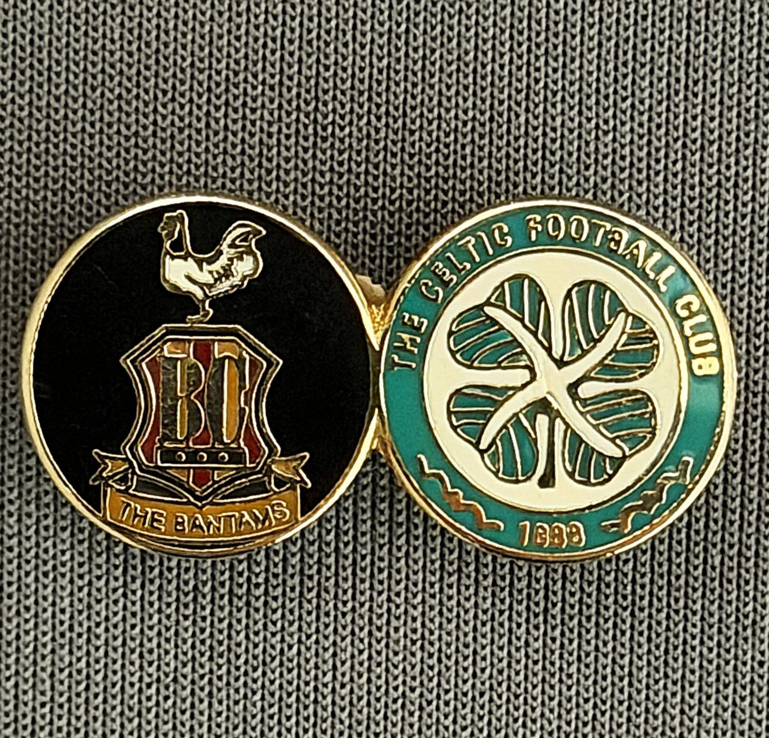 Reference Number: BCUN007
Size: H 12.3 mm x W 24 mm
Pin Type: Brooch Pin
Plating: Gold
Value: £8
Manufacturer: Not Known
Comments: Black, City Celtic Twin Badge