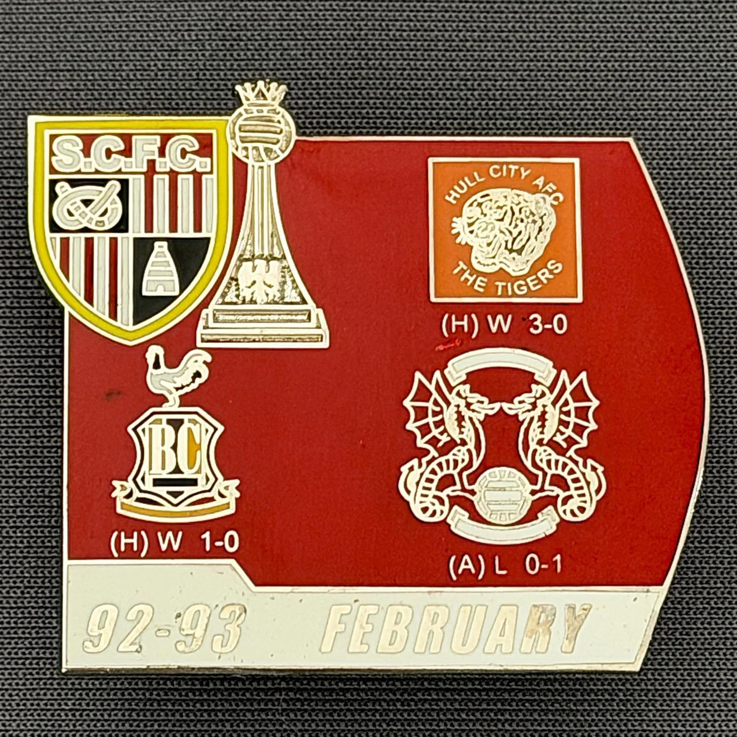Reference Number: BCOFIX127
Size: H 34.6 mm x W 38.2 mm
Pin Type: Double Metal Clutch
Plating: Silver
Value: £5
Manufacturer: Unknown
Comments: Stoke City v Bradford City & Others 1993, Red & White Version 