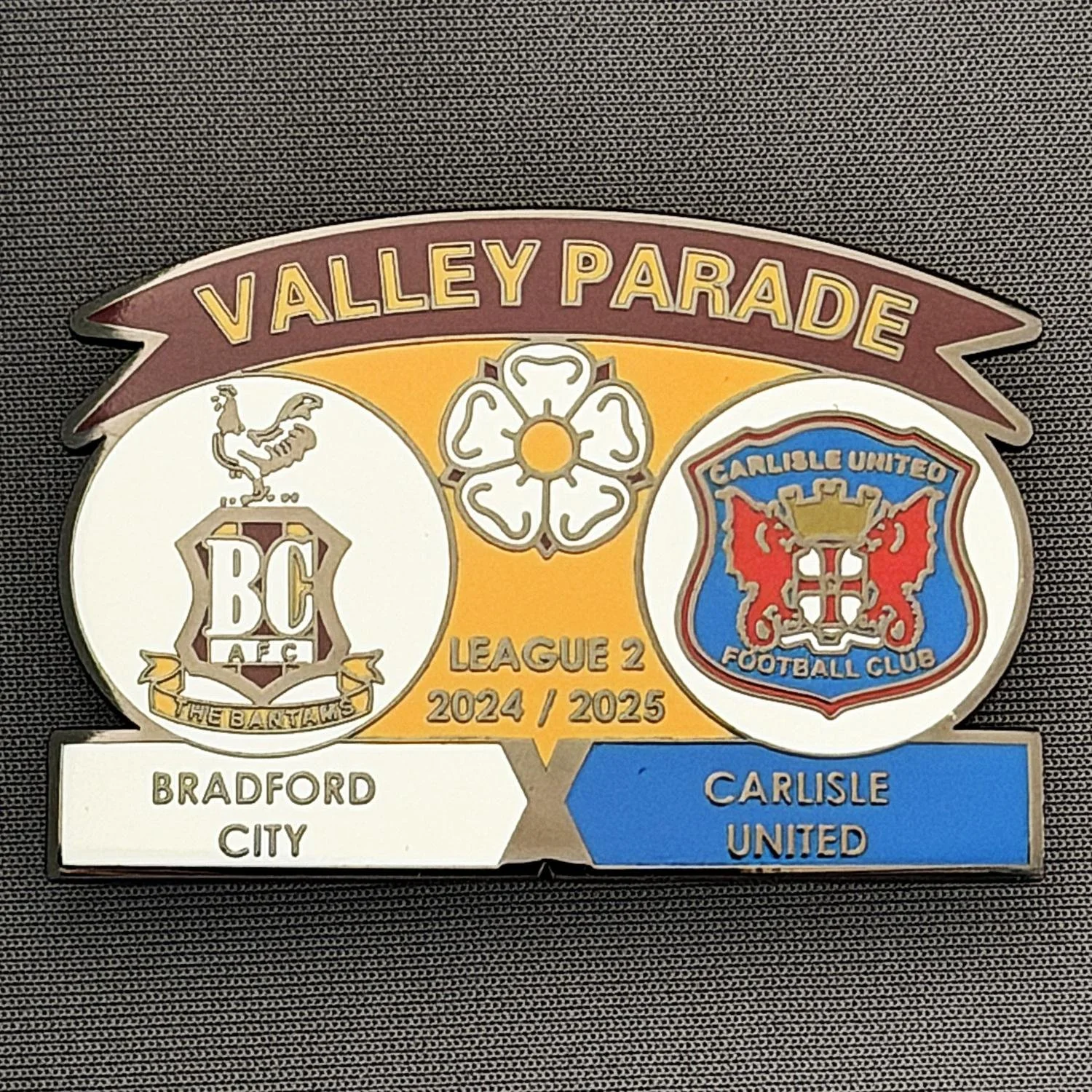 Reference Number: BCFIX418
Size: H 34.3 mm x W 50 mm
Pin Type: Brooch Pin
Plating: Black Nickel
Value: £5
Manufacturer: Unknown
Comments: Bradford City v Carlisle United 2024/25.