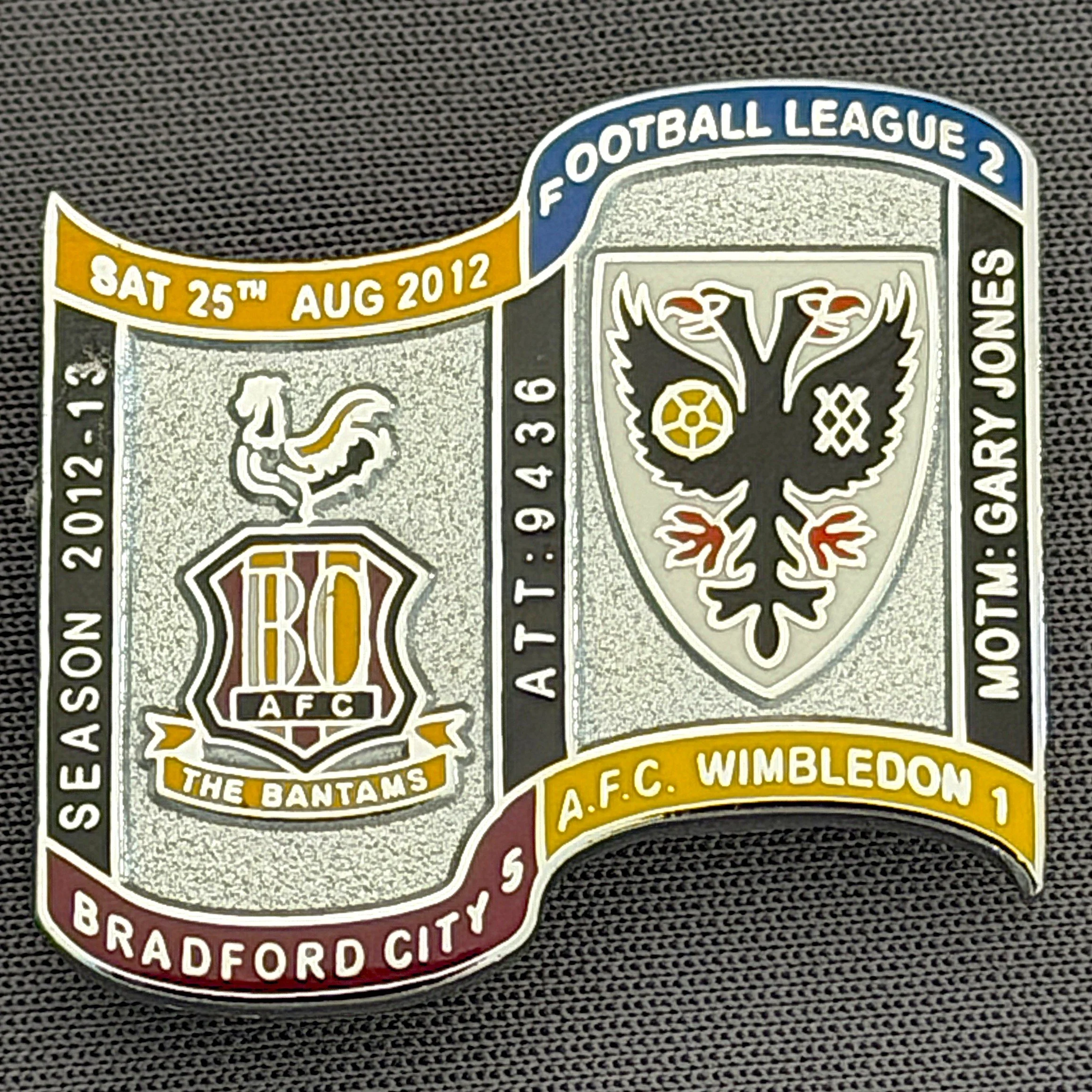 Reference Number: BCFIX140
Size: H 26.9 mm x W 29.2 mm
Pin Type: Brooch Pin
Plating: Chrome
Value: £10
Manufacturer: Bradford City Badges
Comments: Bradford City v A.F.C. Wimbledon  2012/13 Limited Edition 10 Badges (Silver Version)