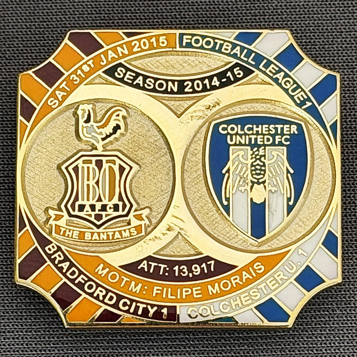 Reference Number: BCFIX267
Size: H 26.8 mm x W 28.8 mm
Pin Type: Brooch Pin
Plating: Gold
Value: £8
Manufacturer: Bradford City Badges
Comments: Bradford City v Colchester United 2014/15, Limited Edition of 50 Badges (Gold Version)