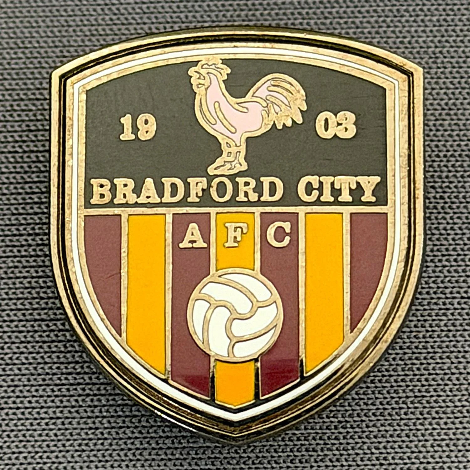 Reference Number: BCC&L160
Size: H 22 mm x 19.5 mm
Pin Type: Brooch Pin
Plating: Black Nickel
Value: £6
Manufacturer: Unknown
Comments: Bradford City Crest Shield, Pink Bantam