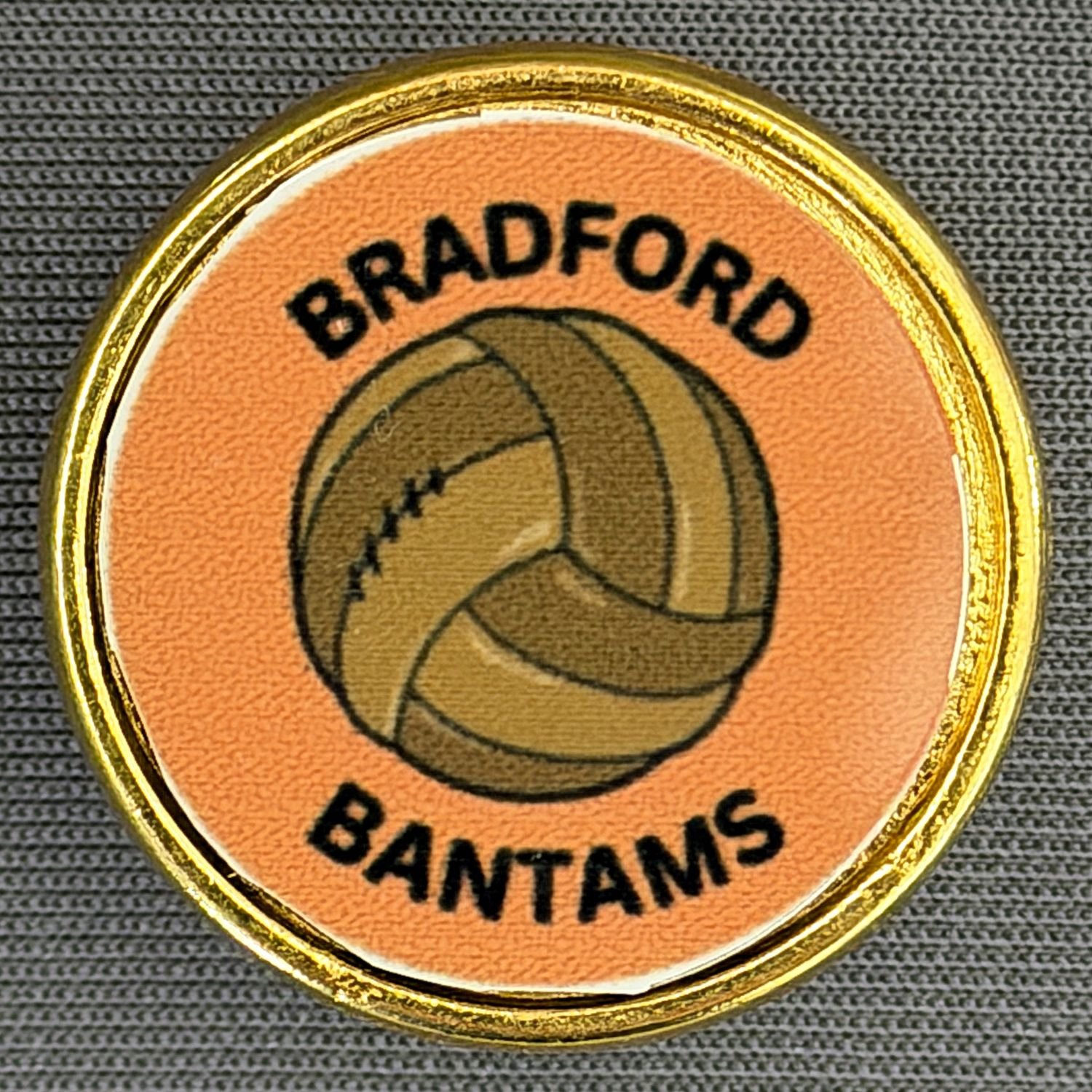 Reference Number: BCBAN093
Size: D 25.4 mm
Pin Type: Metal Clutch
Plating: Gold
Value: £6
Manufacturer: Artgraph
Comments: Circular Bradford Bantams Football
