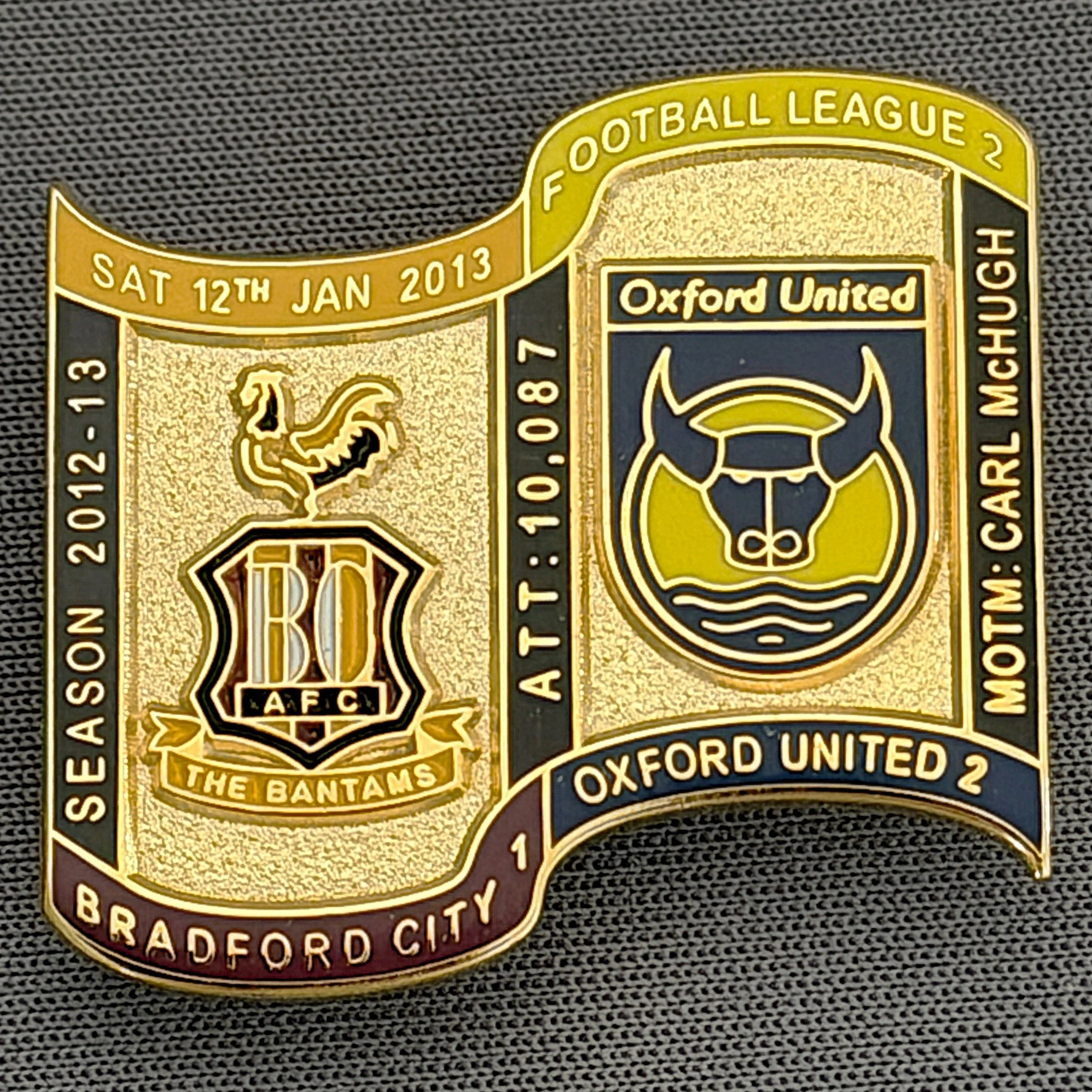 Reference Number: BCFIX129
Size: H 26.9 mm x W 29.2 mm
Pin Type: Brooch Pin
Plating: Gold
Value: £8
Manufacturer: Bradford City Badges
Comments: Bradford City v Oxford United 2012/13 Limited Edition 65 Badges