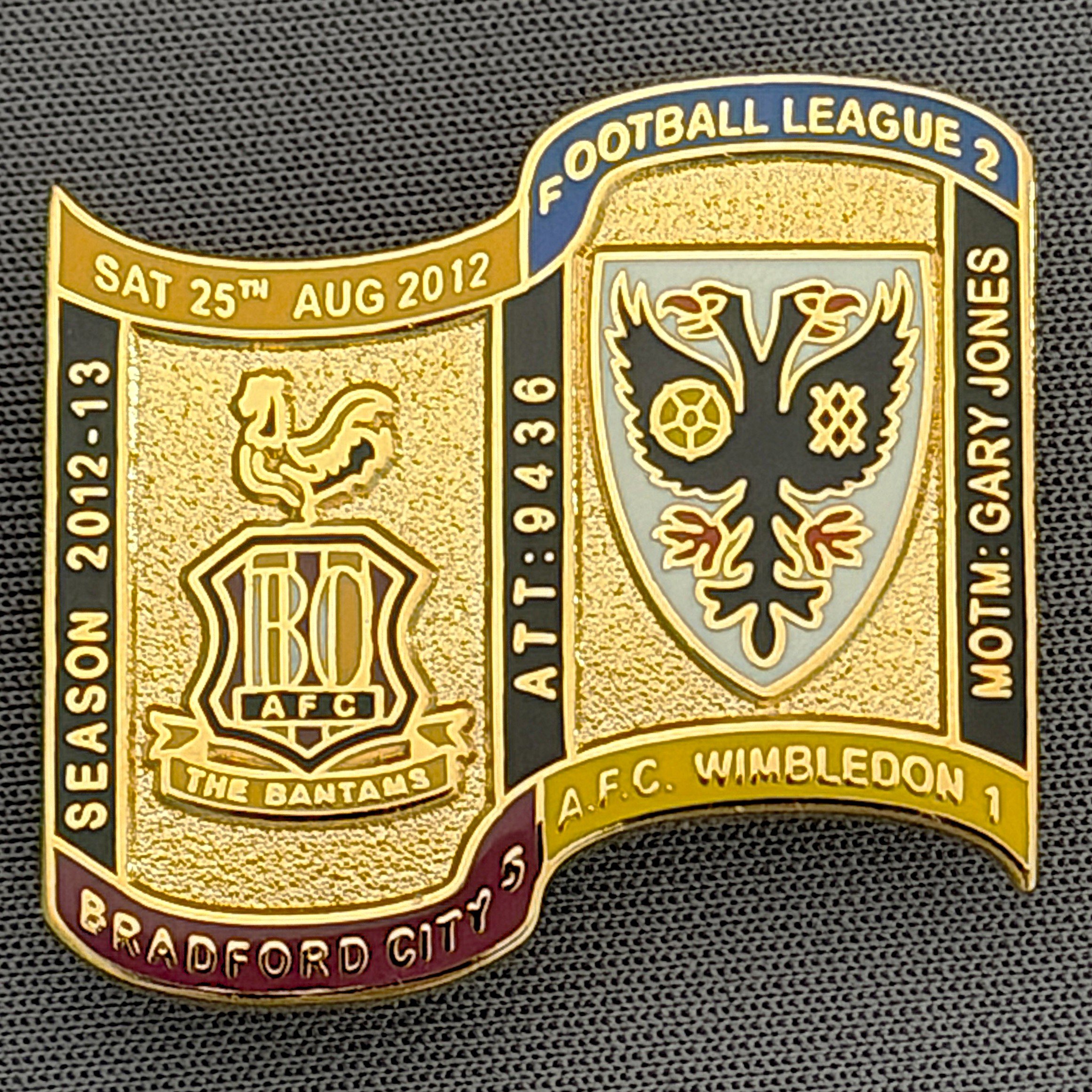 Reference Number: BCFIX117
Size: H 26.9 mm x W 29.2 mm
Pin Type: Brooch Pin
Plating: Gold
Value: £8
Manufacturer: Bradford City Badges
Comments: Bradford City v A.F.C Wimbledon 2012/13 Limited Edition 65 Badges