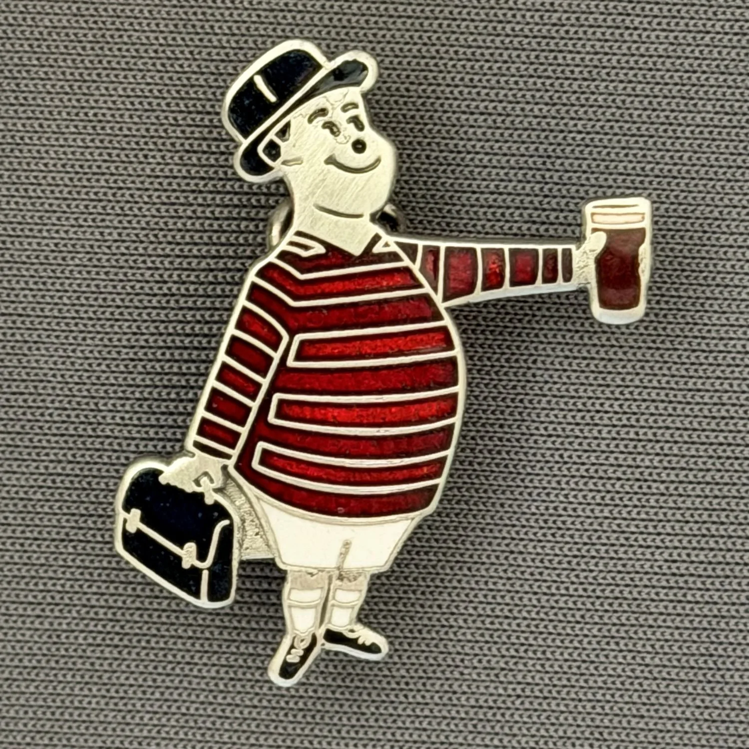 Reference Number: BCGEN072
Size: H 28.8 mm x W 20.9 mm
Pin Type: Brooch Pin
Plating: Antique Silver
Value: £20
Manufacturer: Bradford City Badges
Comments: City Gent Beer Cloisonne, Black Briefcase. One Off Badge.