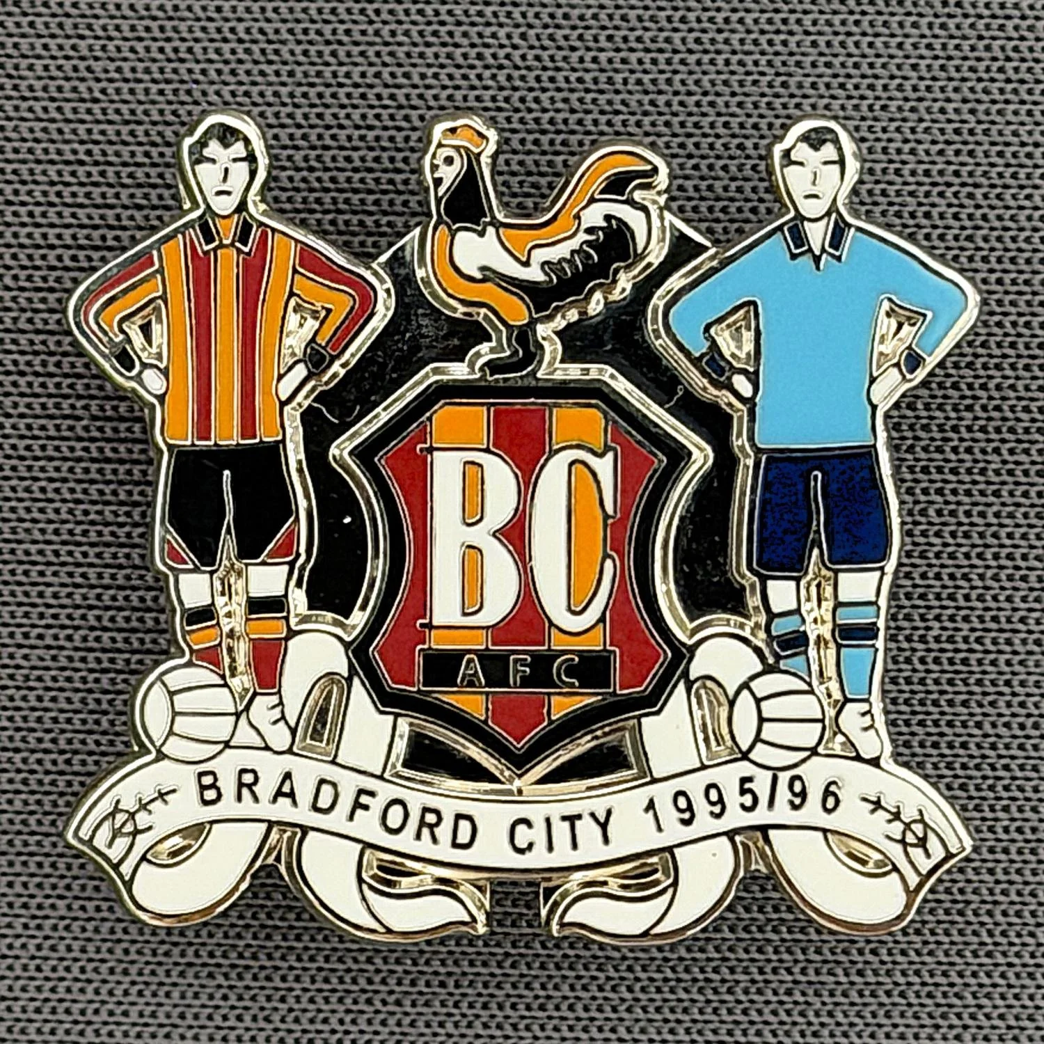 Reference Number: BCEVE061
Size: H 23 mm x W 25.3 mm
Pin Type: Brooch Pin
Plating: Silver
Value: £8
Manufacturer: Paraders
Comments: Bradford City 1995/96
