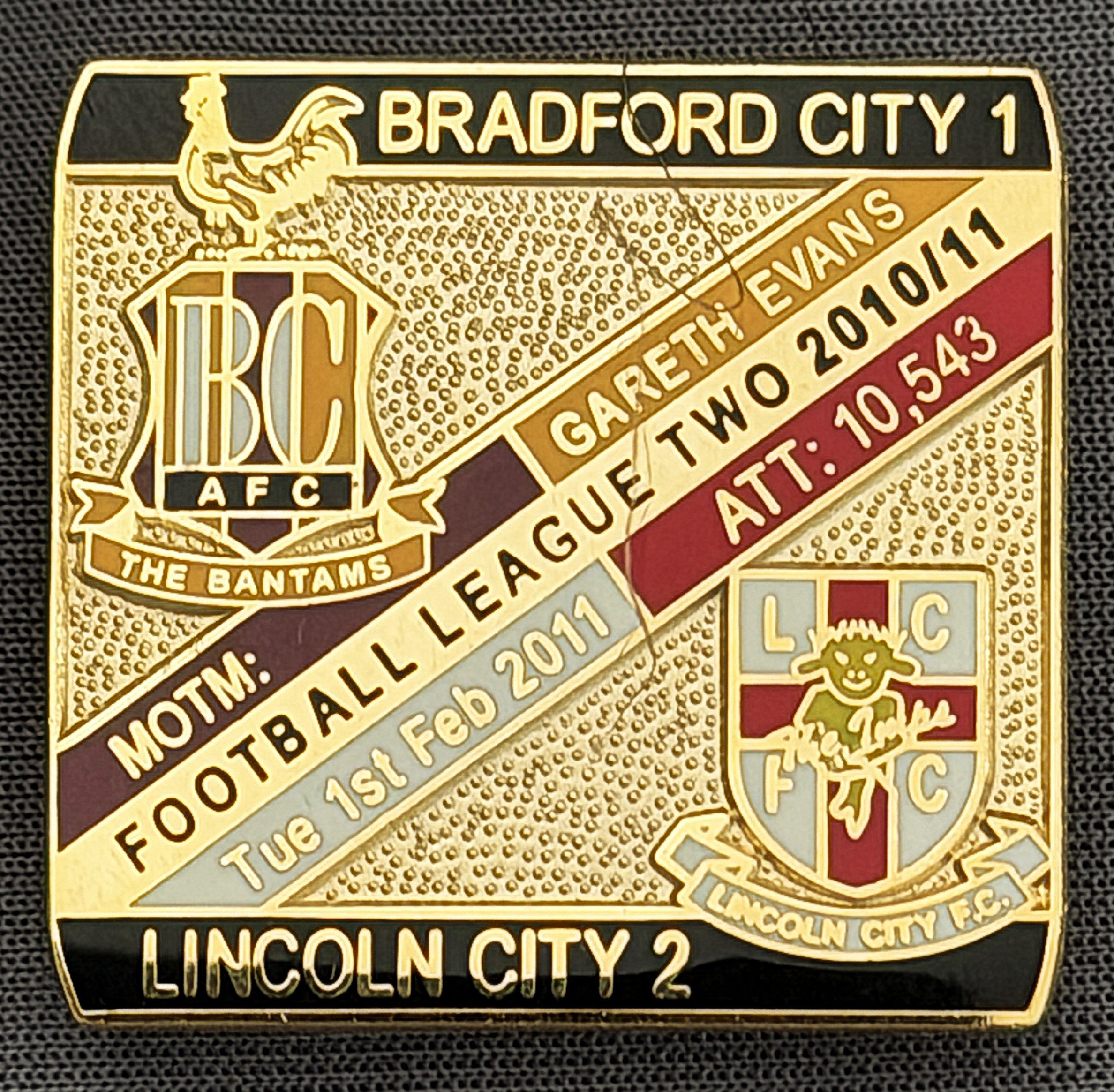Reference Number: BCFIX059
Size: H 28.3 mm x W 29.3 mm
Pin Type: Brooch Pin
Plating: Gold
Value: £8
Manufacturer: Bradford City Badges
Comments: Bradford City v Lincoln City  2010/11 Limited Edition 100 Badges