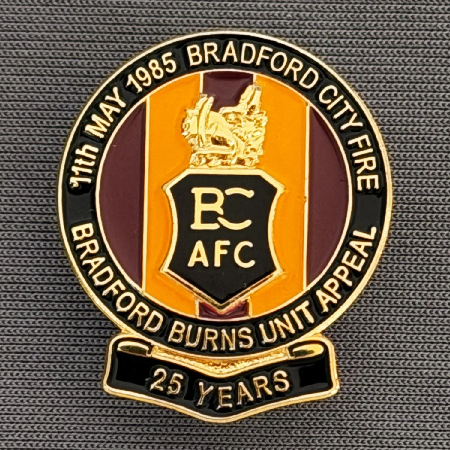 Reference Number: BCFIR005
Size: H 26 mm x W 22 mm
Pin Type: Metal Clutch
Plating: Gold
Value: £10
Manufacturer: Bradford City Badges
Comments: Limited Edition of 250 to raise money for Bradford Burns Unit. Black Version. Sold as set of 3.