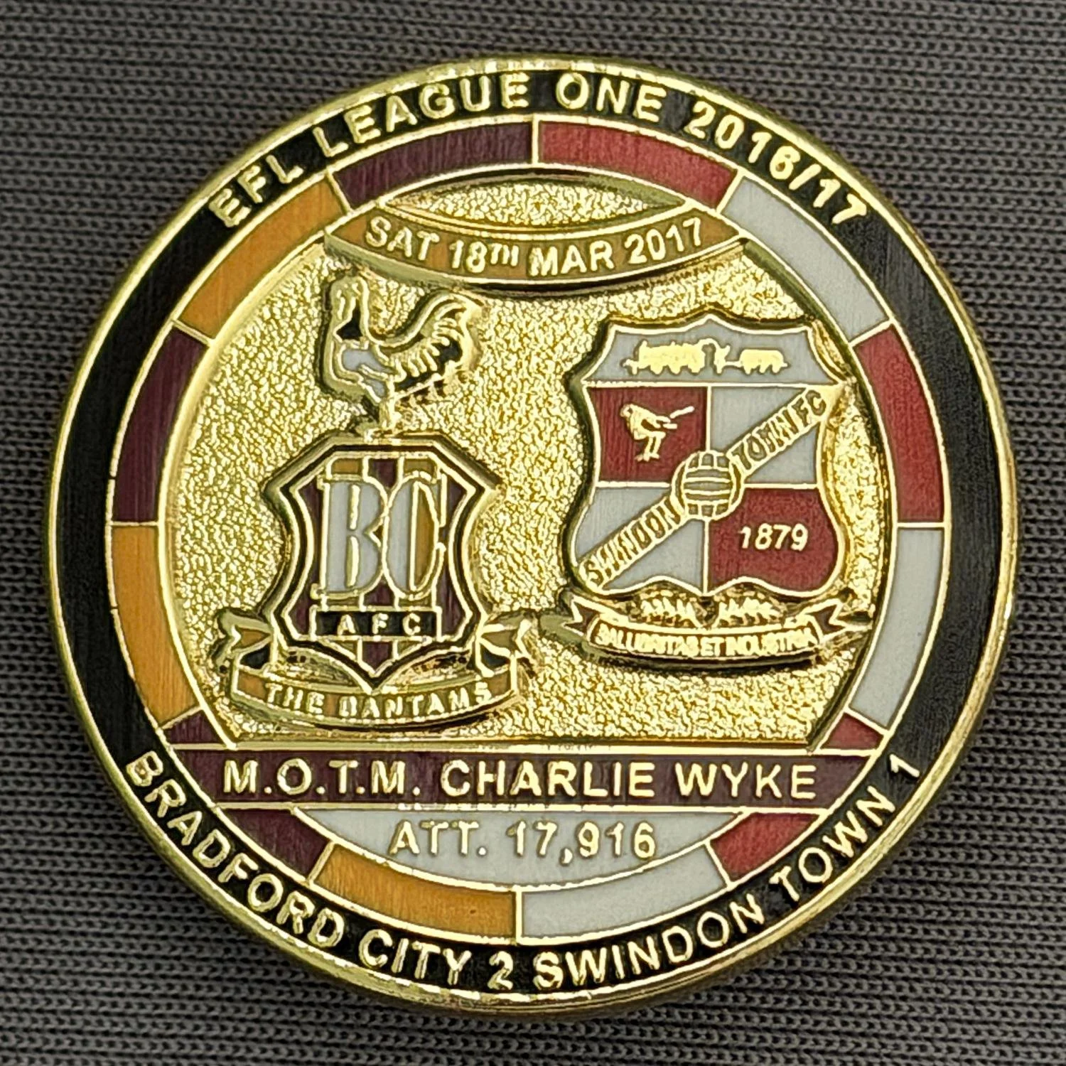 Reference Number: BCFIX388
Size: D 29.4 mm
Pin Type: Brooch Pin
Plating: Gold
Value: £8
Manufacturer: Bradford City Badges
Comments: Bradford City v Swindon Town 2015/16, Limited Edition of 50 Badges (Gold Version)