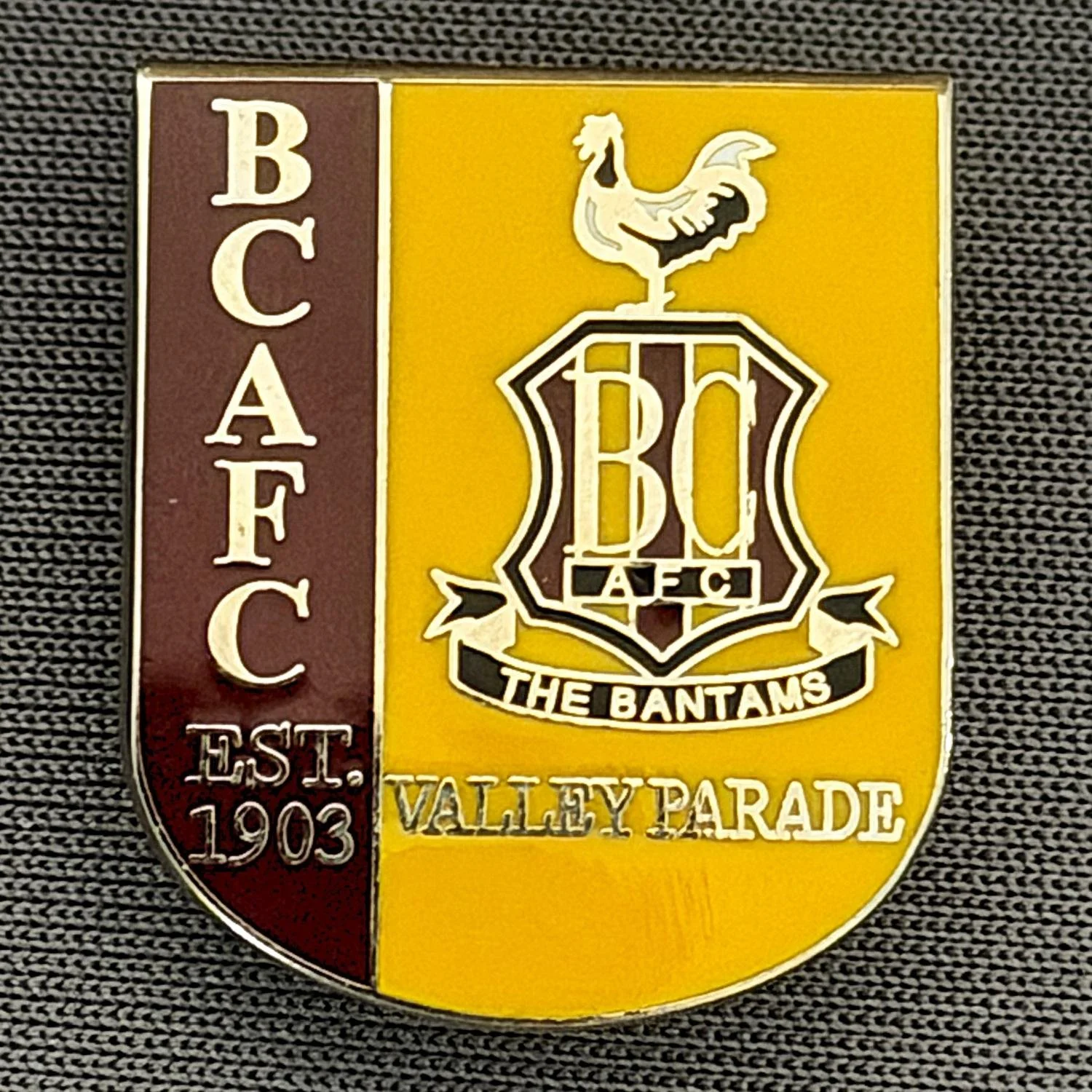 Reference Number: BCC&L154
Size: H 22.3 mm x 18.8 mm
Pin Type: Brooch Pin
Plating: Silver
Value: £6
Manufacturer: Unknown
Comments: BCAFC Claret & Amber Crest Shield