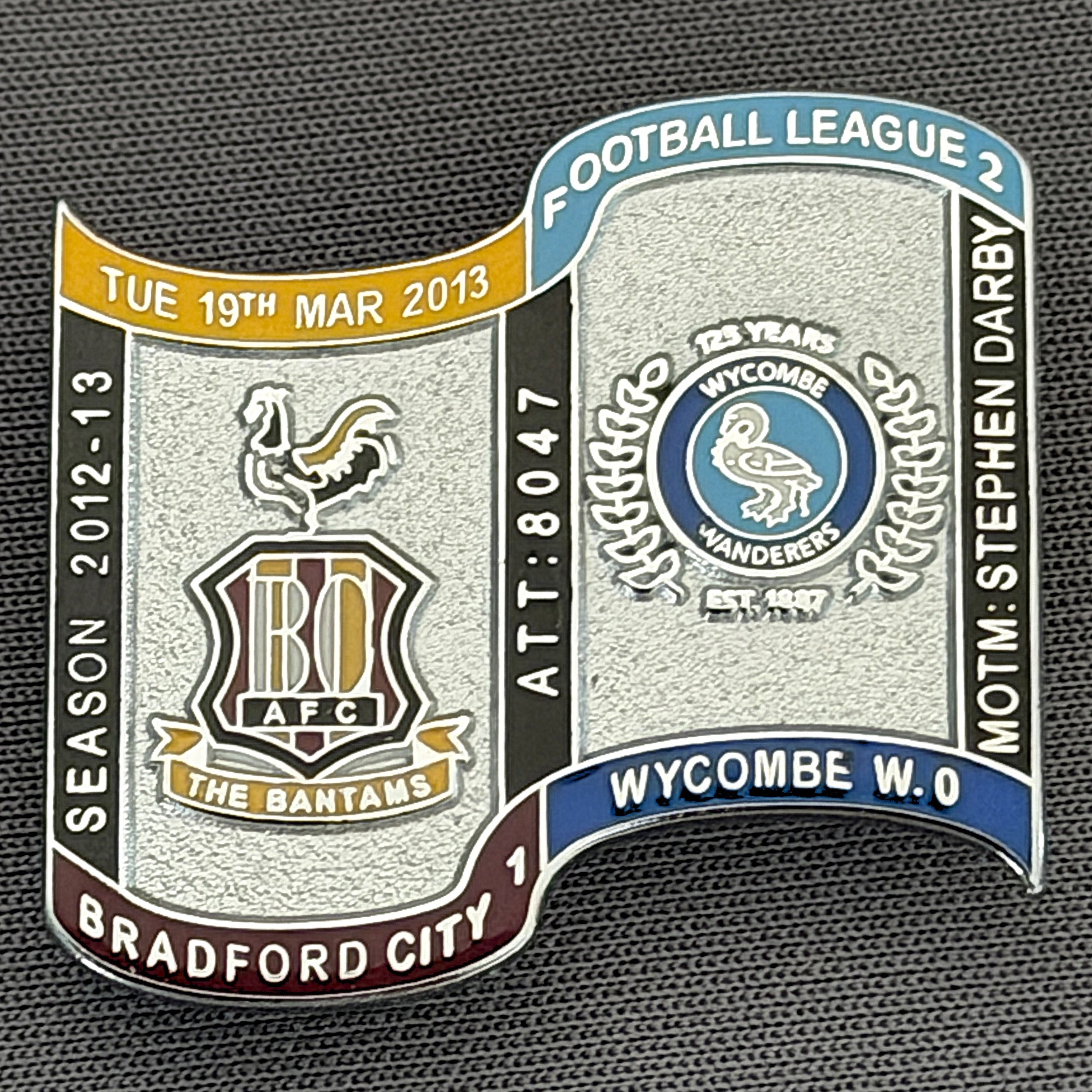 Reference Number: BCFIX156
Size: H 26.9 mm x W 29.2 mm
Pin Type: Brooch Pin
Plating: Chrome
Value: £10
Manufacturer: Bradford City Badges
Comments: Bradford City v Wycombe Wanderers  2012/13 Limited Edition 10 Badges (Silver Version)