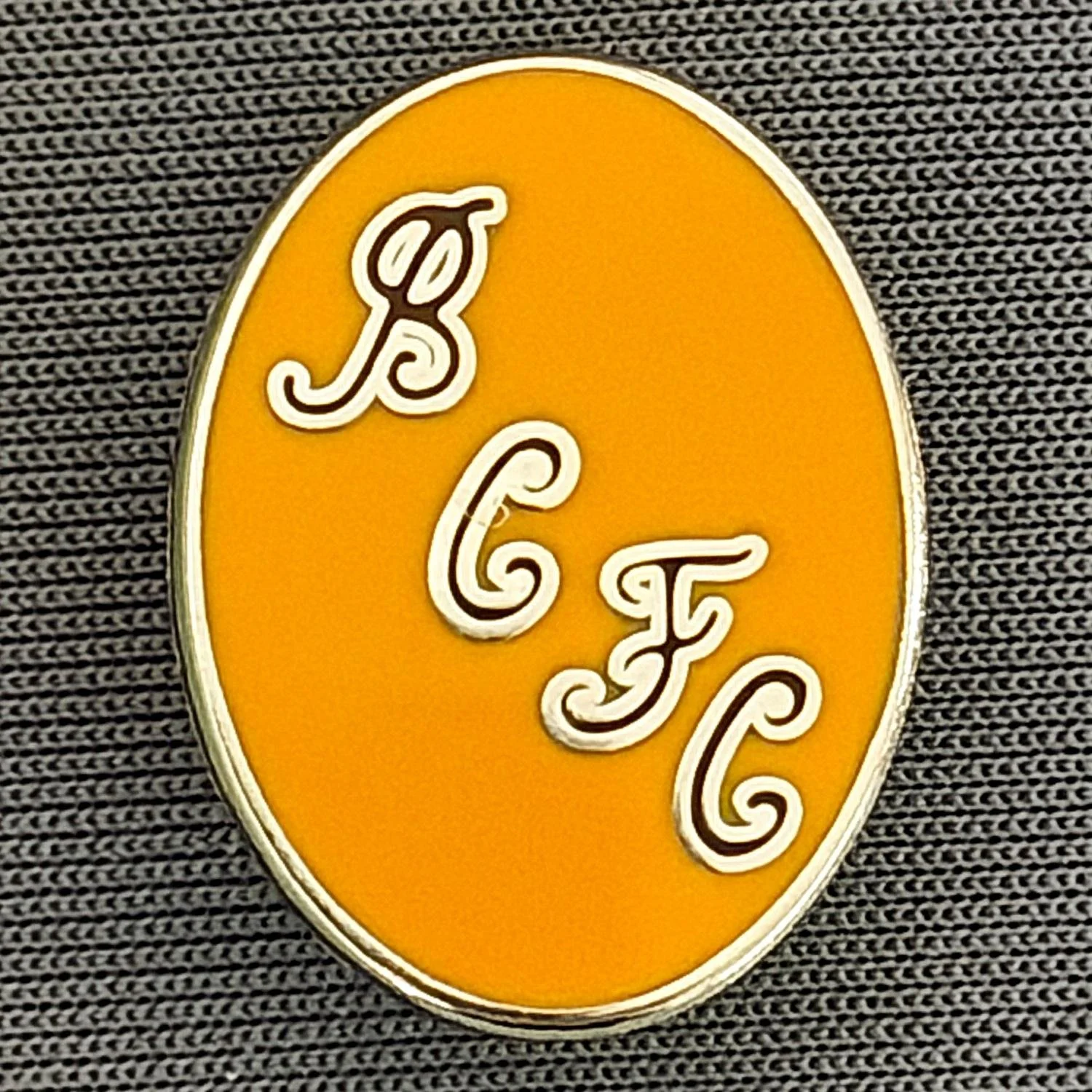 Reference Number: BCBCFC070
Size: H 20.8 mm x W 15.7 mm
Pin Type: Brooch Pin
Plating: Silver
Value: £4
Manufacturer: Unknown
Comments: BCFC Amber Version
