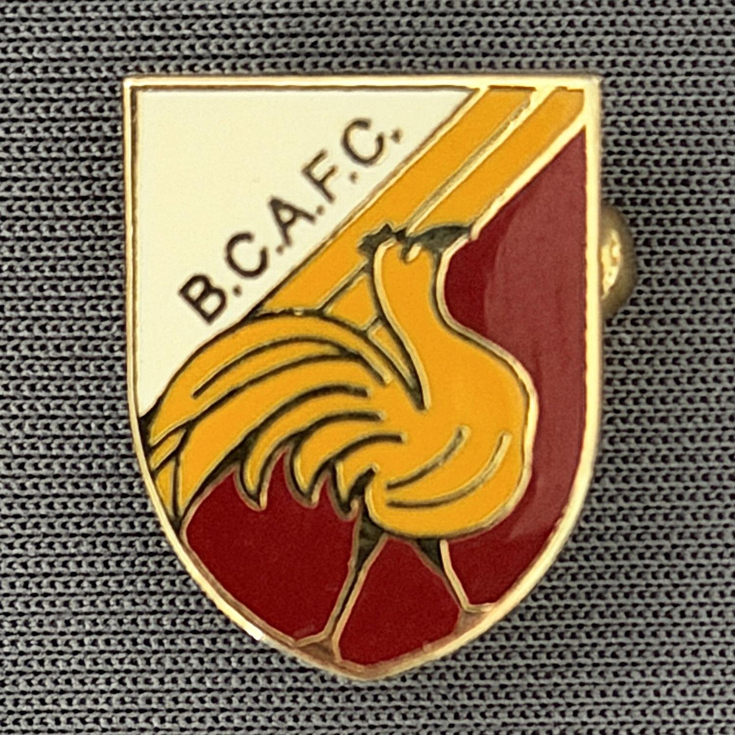 Reference Number: BCBAN043
Size: H 18 mm x W 14.1 mm
Pin Type: Brooch Pin
Plating: Gold
Value: £6
Manufacturer: Unknown
Comments: Amber, Claret & White Bantam Shield