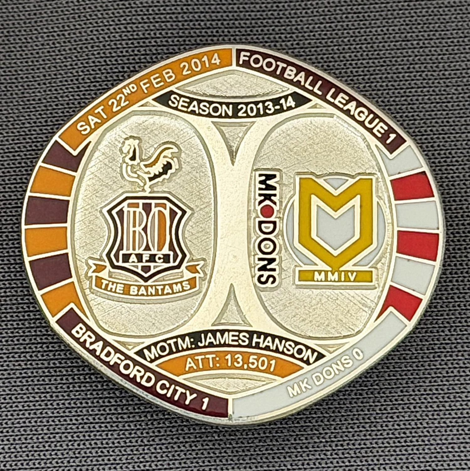 Reference Number: BCFIX224
Size: H 26.3 mm x W 28.9 mm
Pin Type: Brooch Pin
Plating: Silver
Value: £10
Manufacturer: Bradford City Badges
Comments: Bradford City v M.K. Dons 2013/14 Limited Edition 10 Badges (Silver Version)