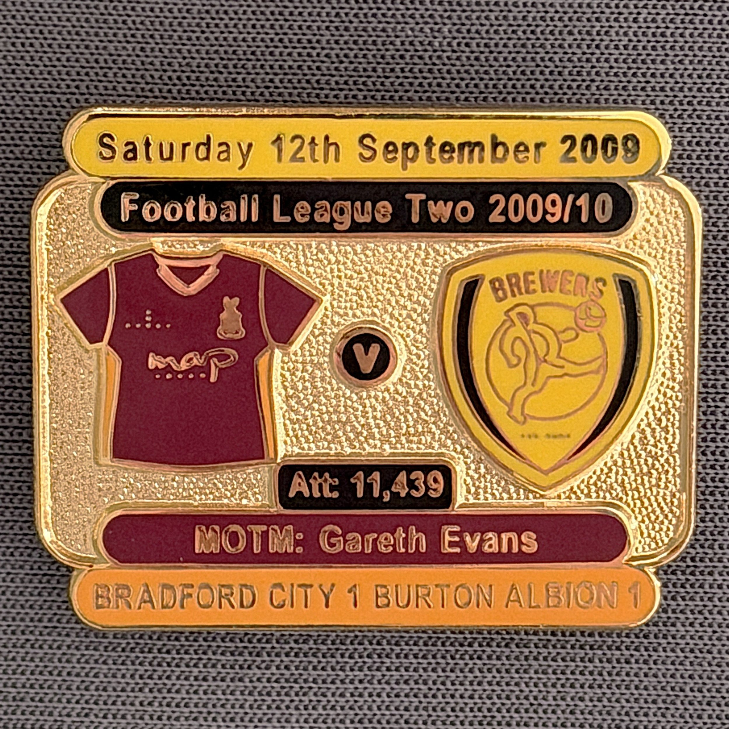Reference Number: BCFIX027
Size: H 23.1 mm x W 29 mm
Pin Type: Brooch Pin
Plating: Gold
Value: £8
Manufacturer: Bradford City Badges
Comments: Bradford City v Burton Albion 2009/10 Limited Edition 100 Badges