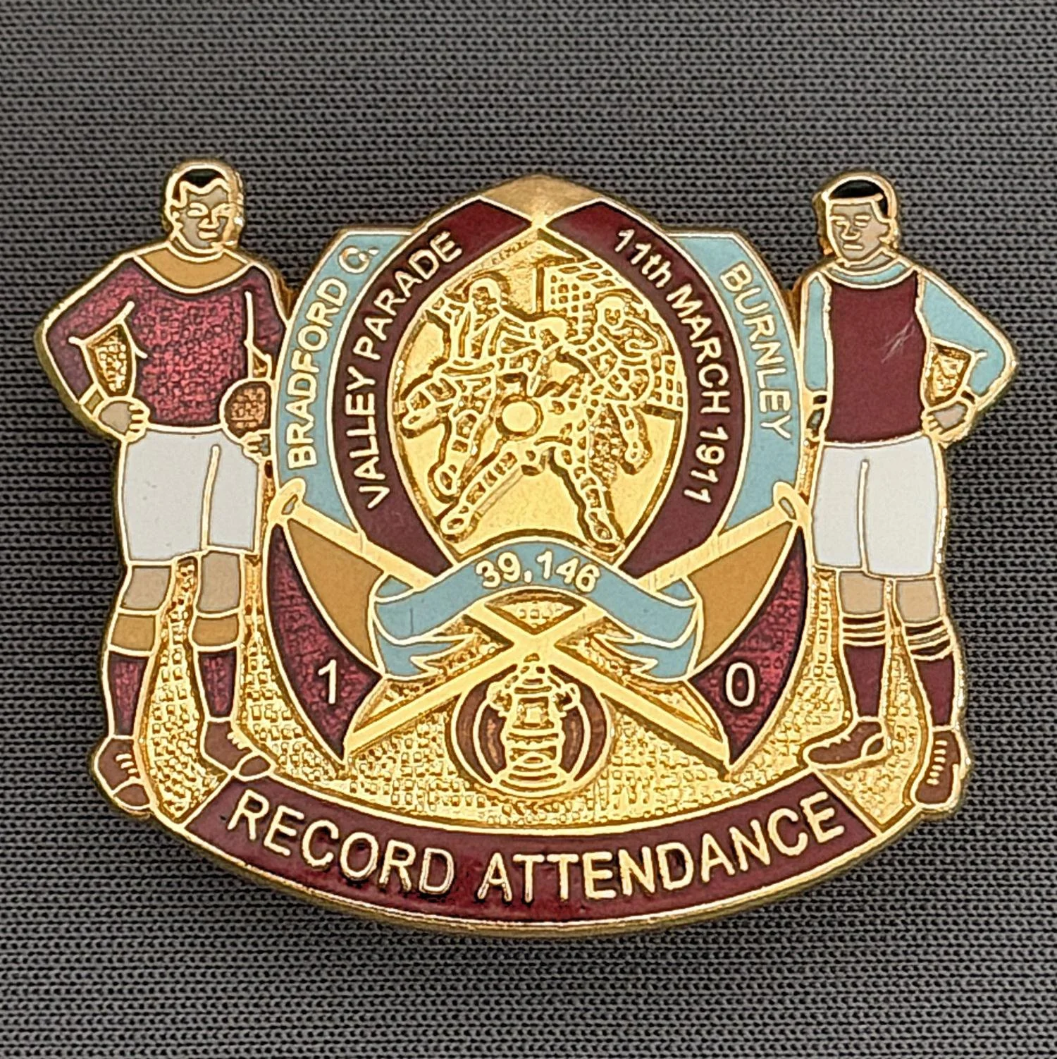Reference Number: BCEVE030
Size: H 30.9mm x W 38.1 mm
Pin Type: Double Metal Clutch
Plating: Gold
Value: £20
Manufacturer: AKP Designs
Comments: Record Attendance 1911 Valley Parade