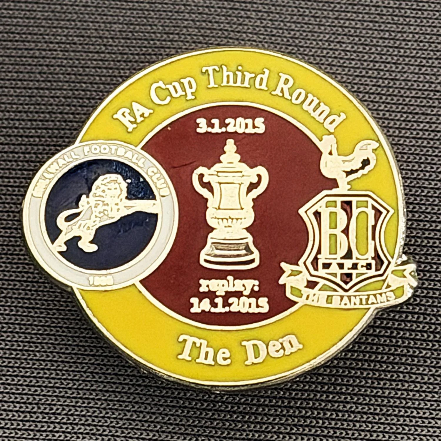Reference Number: BCFAC076
Size: H 22.7 mm x W 26 mm
Pin Type: Metal Clutch
Plating: Silver
Value: £4
Manufacturer: Dan Lloyd
Comments: F.A. Cup Third Round 2014/15, Away v Millwall, Amber & Claret Version