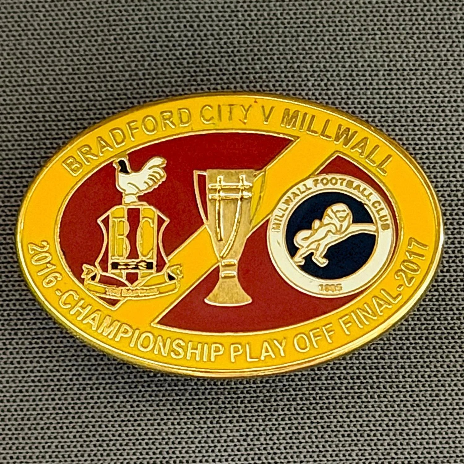 Reference Number: BCOFIX041
Size: H 17.9 mm x W 26 mm
Pin Type: Rubber Clutch
Plating: Gold
Value: £6
Manufacturer: Tricky's Pins
Comments: Play Off Final City v Millwall 2017, Amber & Claret Version