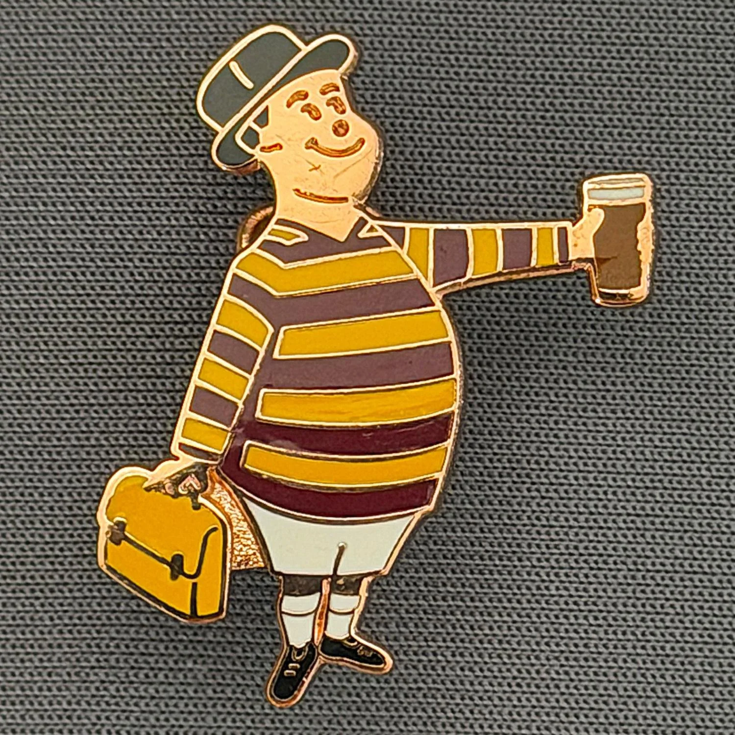 Reference Number: BCGEN060
Size: H 28.8 mm x W 20.9 mm
Pin Type: Brooch Pin
Plating: Copper
Value: £15
Manufacturer: Bradford City Badges
Comments: City Gent Beer, Amber Briefcase. Limited Edition Set of 15.