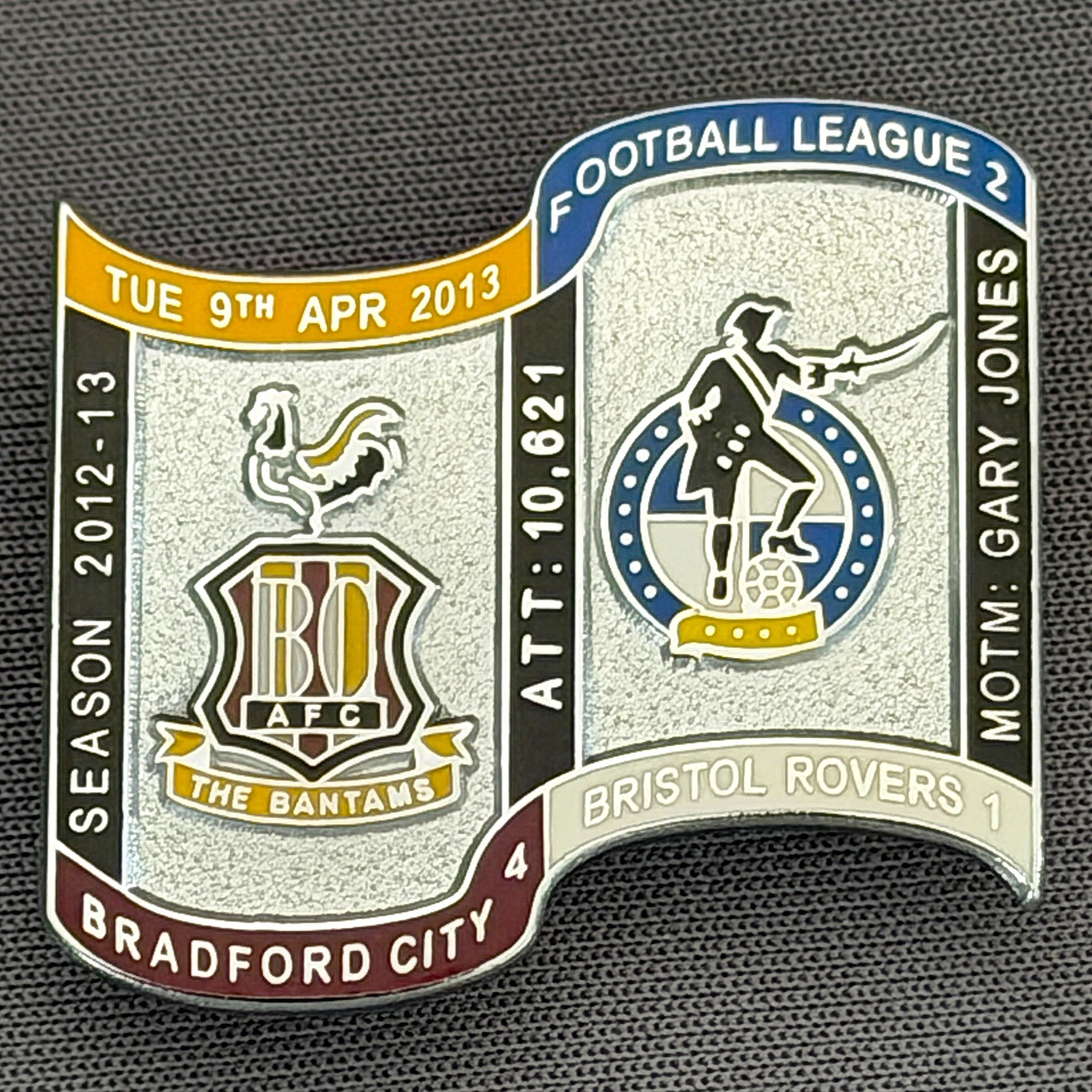 Reference Number: BCFIX159
Size: H 26.9 mm x W 29.2 mm
Pin Type: Brooch Pin
Plating: Chrome
Value: £10
Manufacturer: Bradford City Badges
Comments: Bradford City v Bristol Rovers  2012/13 Limited Edition 10 Badges (Silver Version)