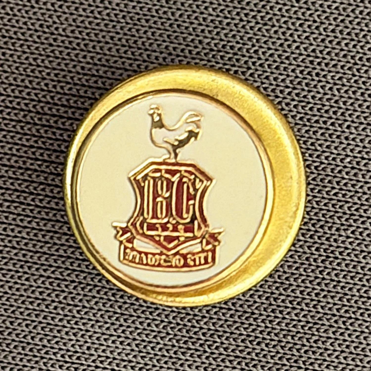 Reference Number: BCC&L033
Size: D 9.9 mm
Pin Type: Metal Clutch
Plating: Gold
Value: £8
Manufacturer: Unknown
Comments: Tiny White City Logo