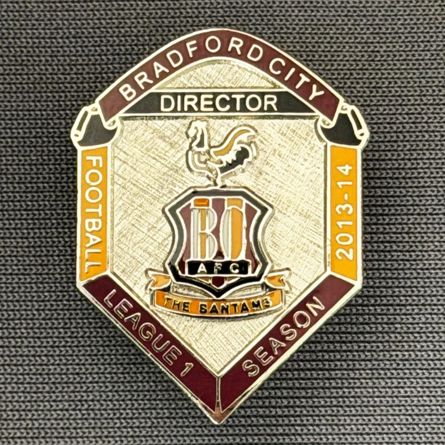 Reference Number: BCDIR003
Size: H 25.5 mm x W 19.5 mm
Pin Type: Brooch Pin
Plating: Nickel
Value: £40
Manufacturer: Bradford City Badges
Comments: Worn by C.E.O. & Directors