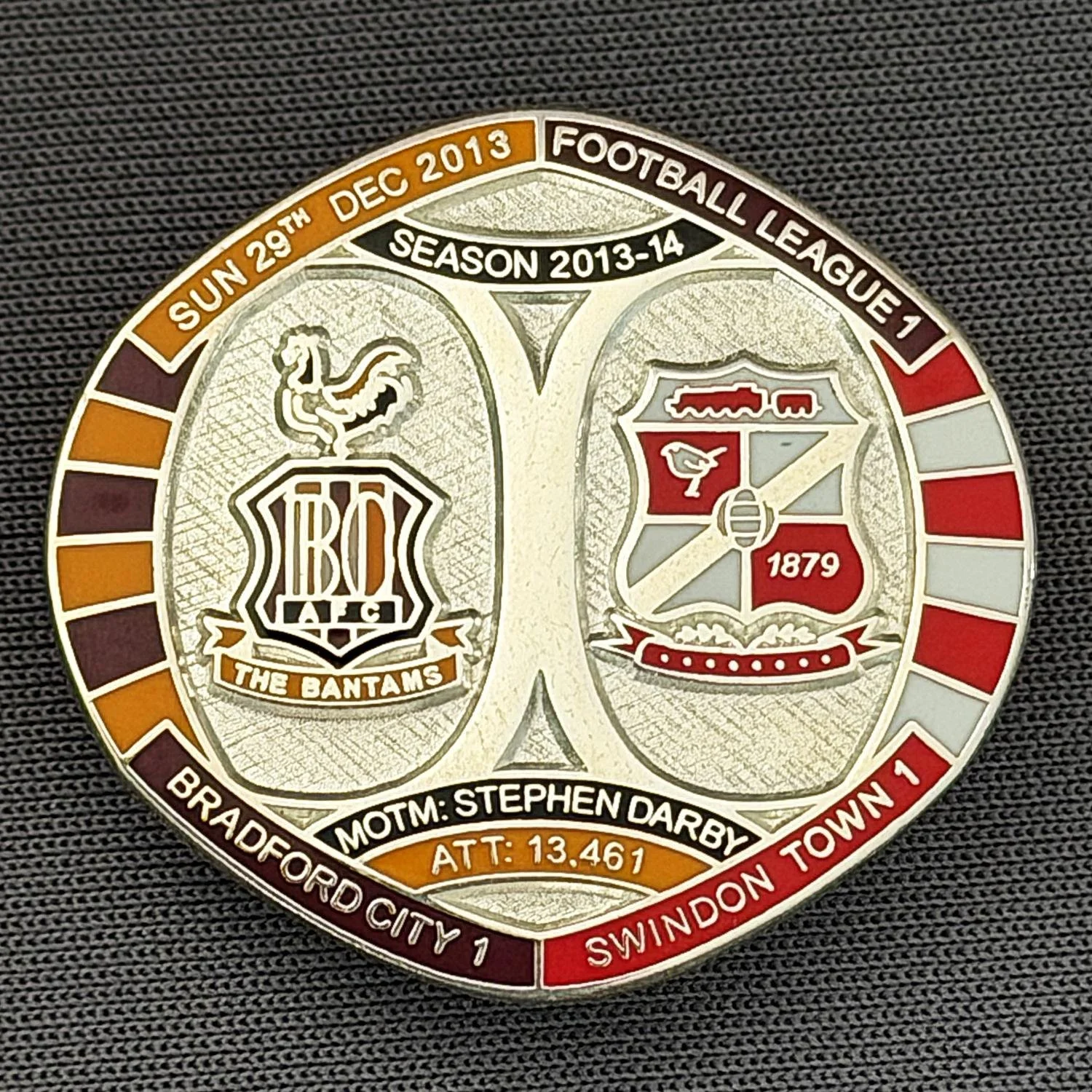 Reference Number: BCFIX219
Size: H 26.3 mm x W 28.9 mm
Pin Type: Brooch Pin
Plating: Silver
Value: £10
Manufacturer: Bradford City Badges
Comments: Bradford City v Swindon Town  2013/14 Limited Edition 10 Badges (Silver Version)