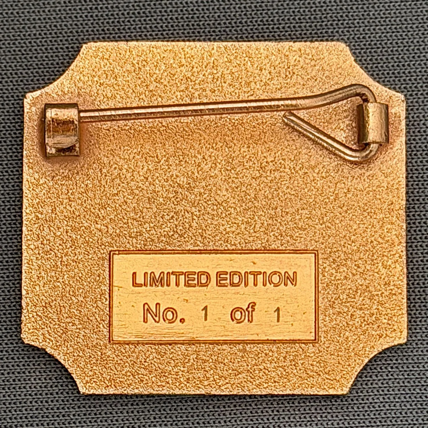 Back side of a limited edition collectible card with a pin attached at the top, displaying the text 'LIMITED EDITION No. 1 of 1.'