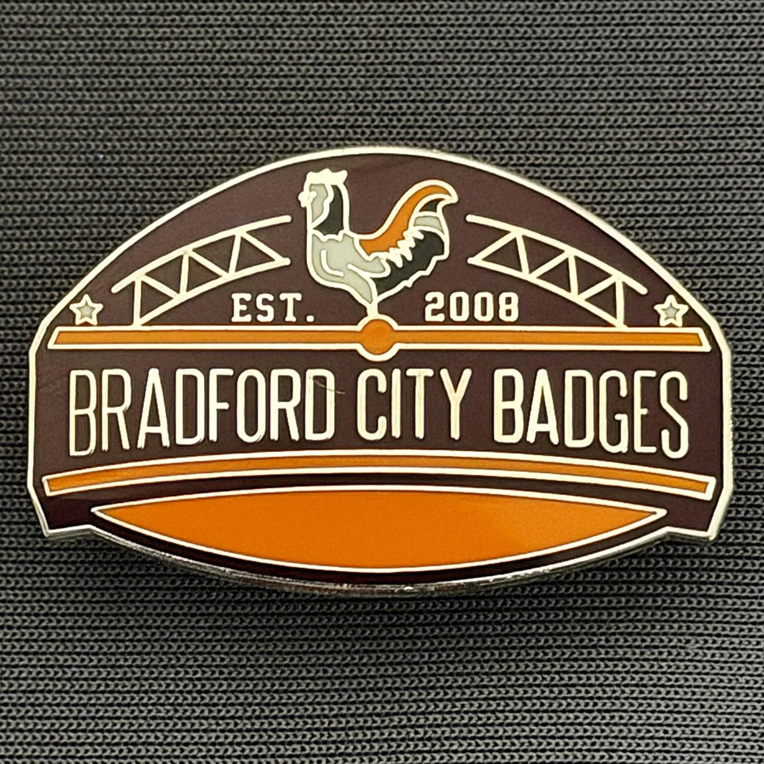 Reference Number: BCUN052
Size: H 20.5 mm x W 32 mm
Pin Type: Metal Clutch
Plating: Silver
Value: £10
Manufacturer: Bradford City Badges
Comments: Bradford City Badges Badge, Limited Edition of 1.