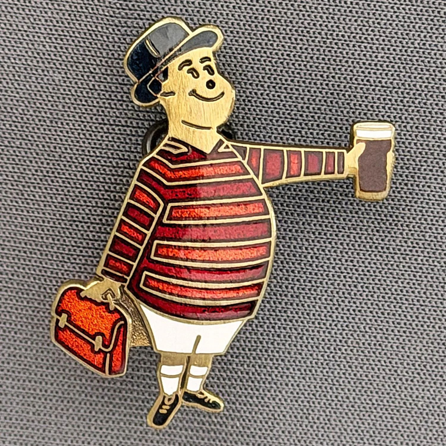 Reference Number: BCGEN091
Size: H 28.8 mm x W 20.9 mm
Pin Type: Brooch Pin
Plating: Antique Gold
Value: £20
Manufacturer: Bradford City Badges
Comments: City Gent Beer Cloisonne, Amber Briefcase. One Off Badge.