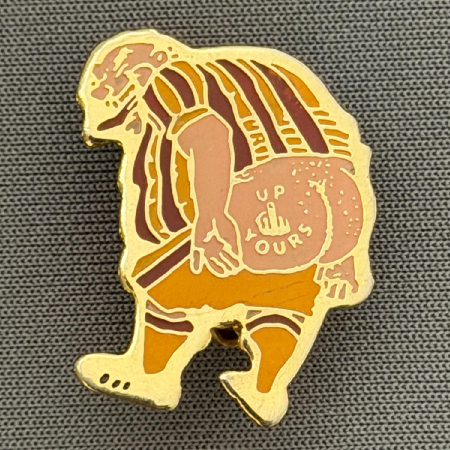 Reference Number: BCCTN019
Size: H 22.1 mm x W 18.5 mm
Pin Type: Brooch Pin
Plating: Gold
Value: £6
Manufacturer: Not Known
Comments: Up Yours in Bradford City Kit
