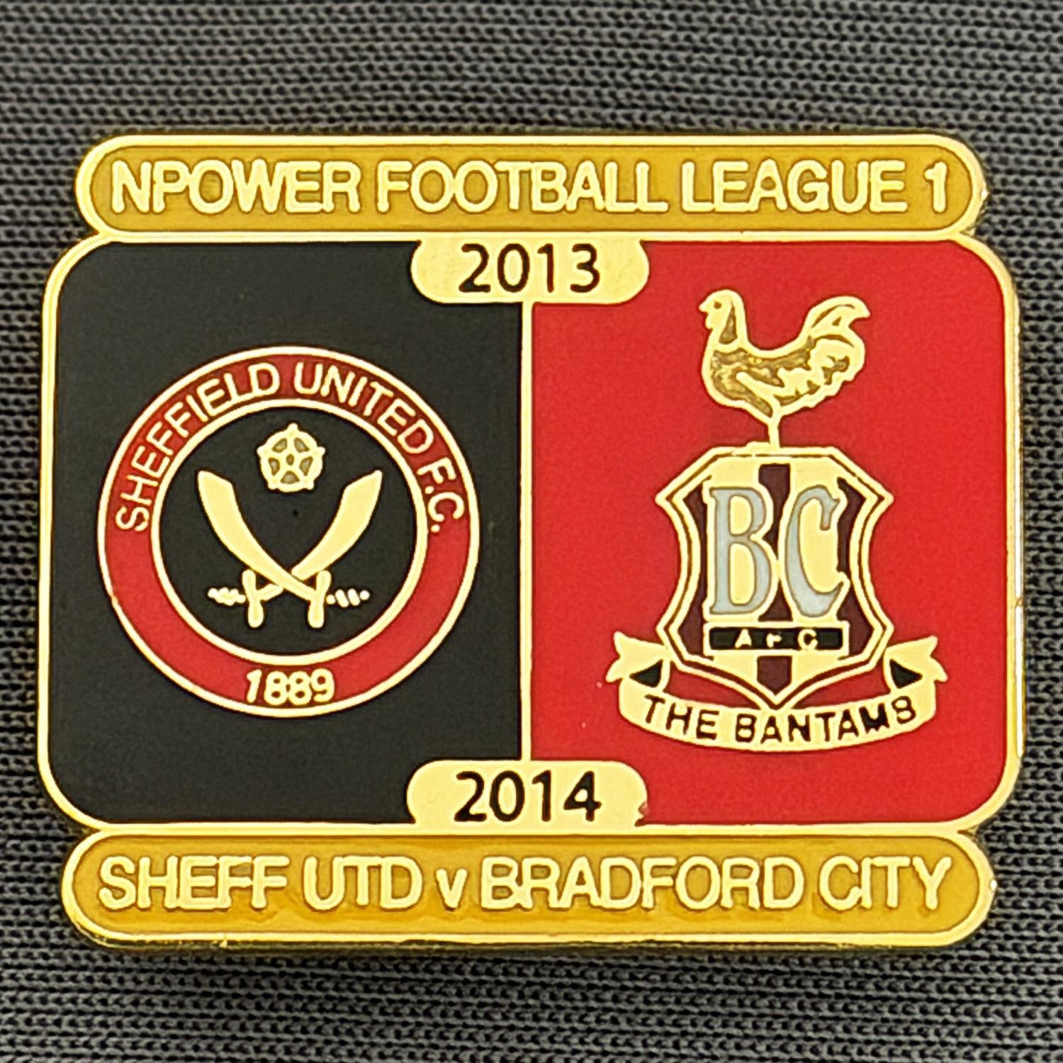 Reference Number: BCOFIX076
Size: H 21.7 mm x W 25.6 mm
Pin Type: Brooch Pin
Plating: Gold
Value: £5
Manufacturer: Unknown
Comments: Sheffield United v Bradford City, League One, Black & Red Version