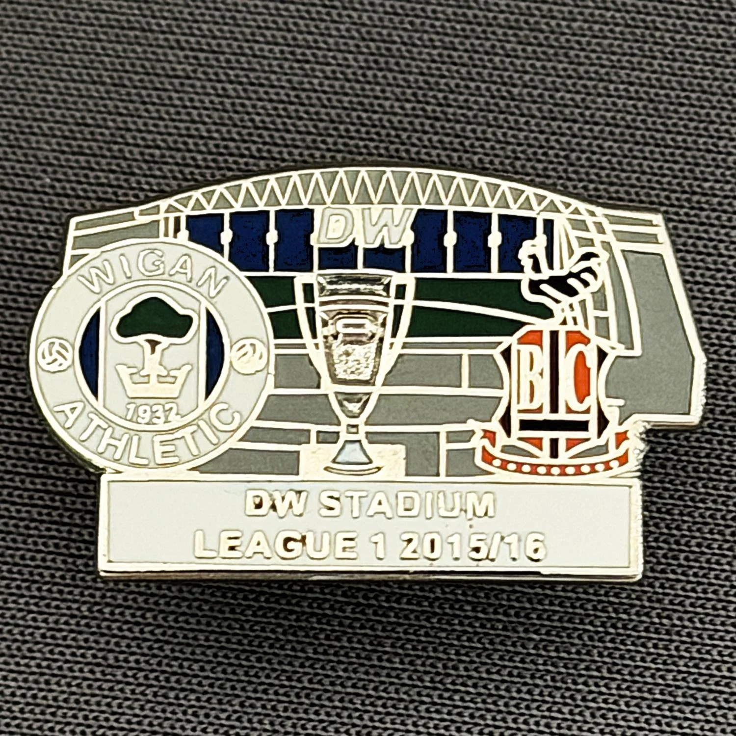 Reference Number: BCOFIX119
Size: H 15.8 mm x W 25 mm
Pin Type: Metal Clutch
Plating: Silver
Value: £5
Manufacturer: Unknown
Comments: Wigan v Bradford City, League One 2015/16, White Version 
