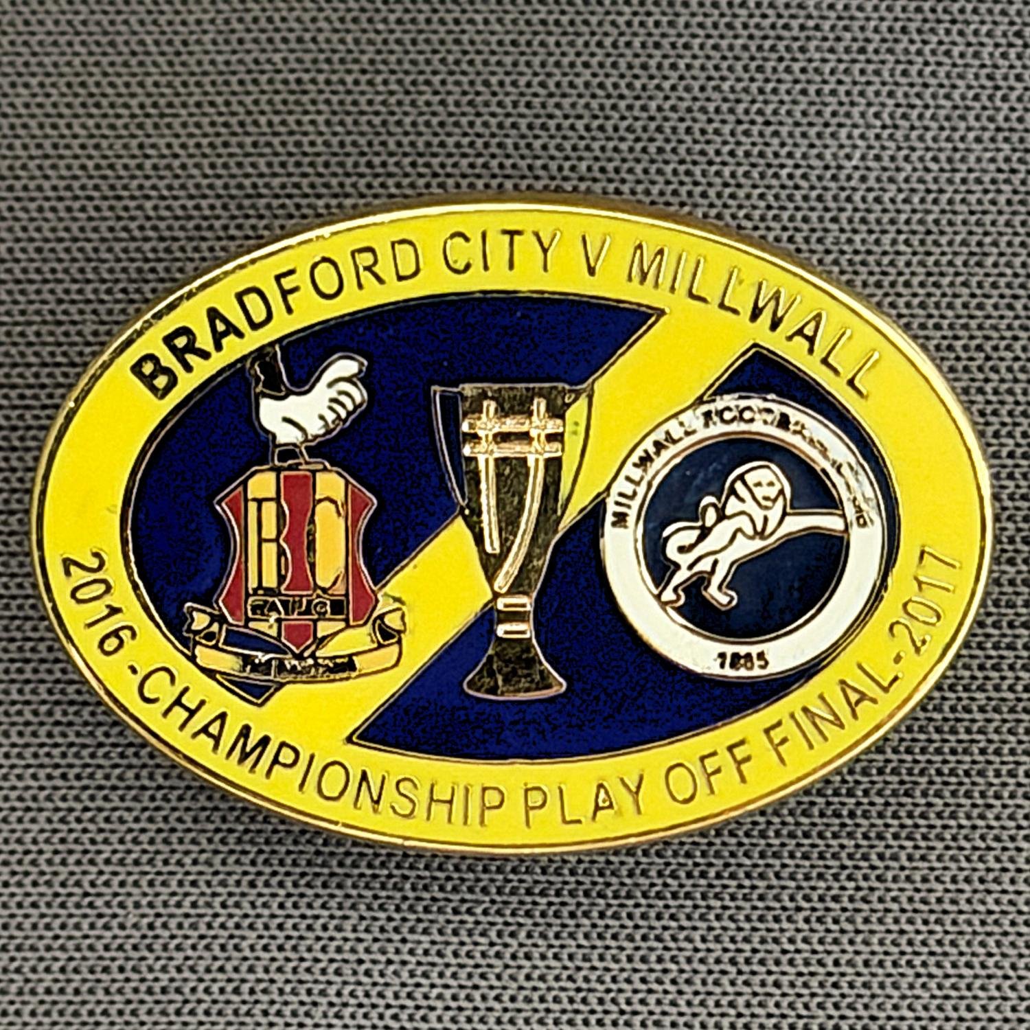 Reference Number: BCOFIX045
Size: H 17.9 mm x W 26 mm
Pin Type: Rubber Clutch
Plating: Gold
Value: £6
Manufacturer: Tricky's Pins
Comments: Play Off Final City v Millwall 2017, Yellow & Blue Version