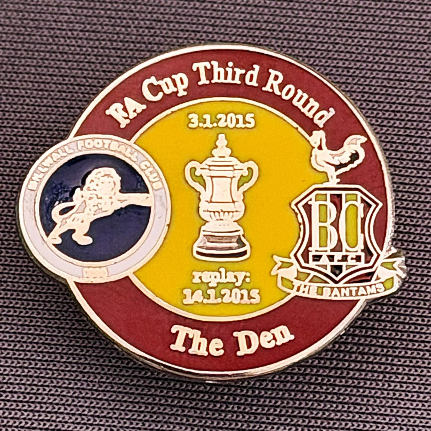 Reference Number: BCFAC075
Size: H 22.7 mm x W 26 mm
Pin Type: Metal Clutch
Plating: Silver
Value: £4
Manufacturer: Dan Lloyd
Comments: F.A. Cup Third Round 2014/15, Away v Millwall, Claret & Amber Version