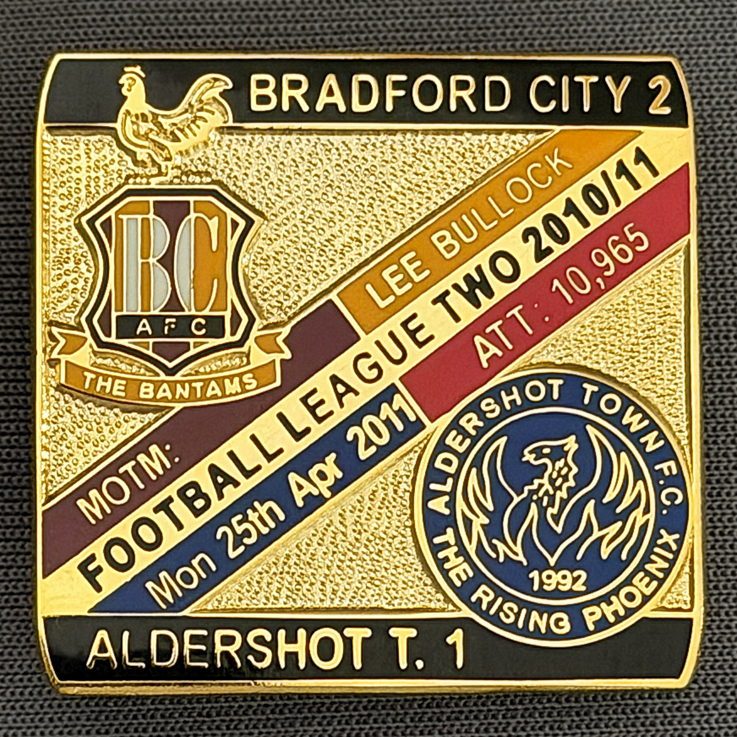 Reference Number: BCFIX068
Size: H 28.3 mm x W 29.3 mm
Pin Type: Brooch Pin
Plating: Gold
Value: £8
Manufacturer: Bradford City Badges
Comments: Bradford City v Aldershot Town  2010/11 Limited Edition 100 Badges
