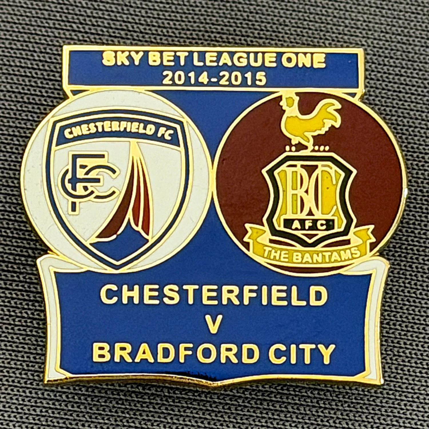 Reference Number: BCOFIX154
Size: H 22.8 mm x W 25.4 mm
Pin Type: Brooch Pin
Plating: Gold
Value: £5
Manufacturer: Terry's Badges
Comments: Chesterfield v Bradford City League One 2015/15