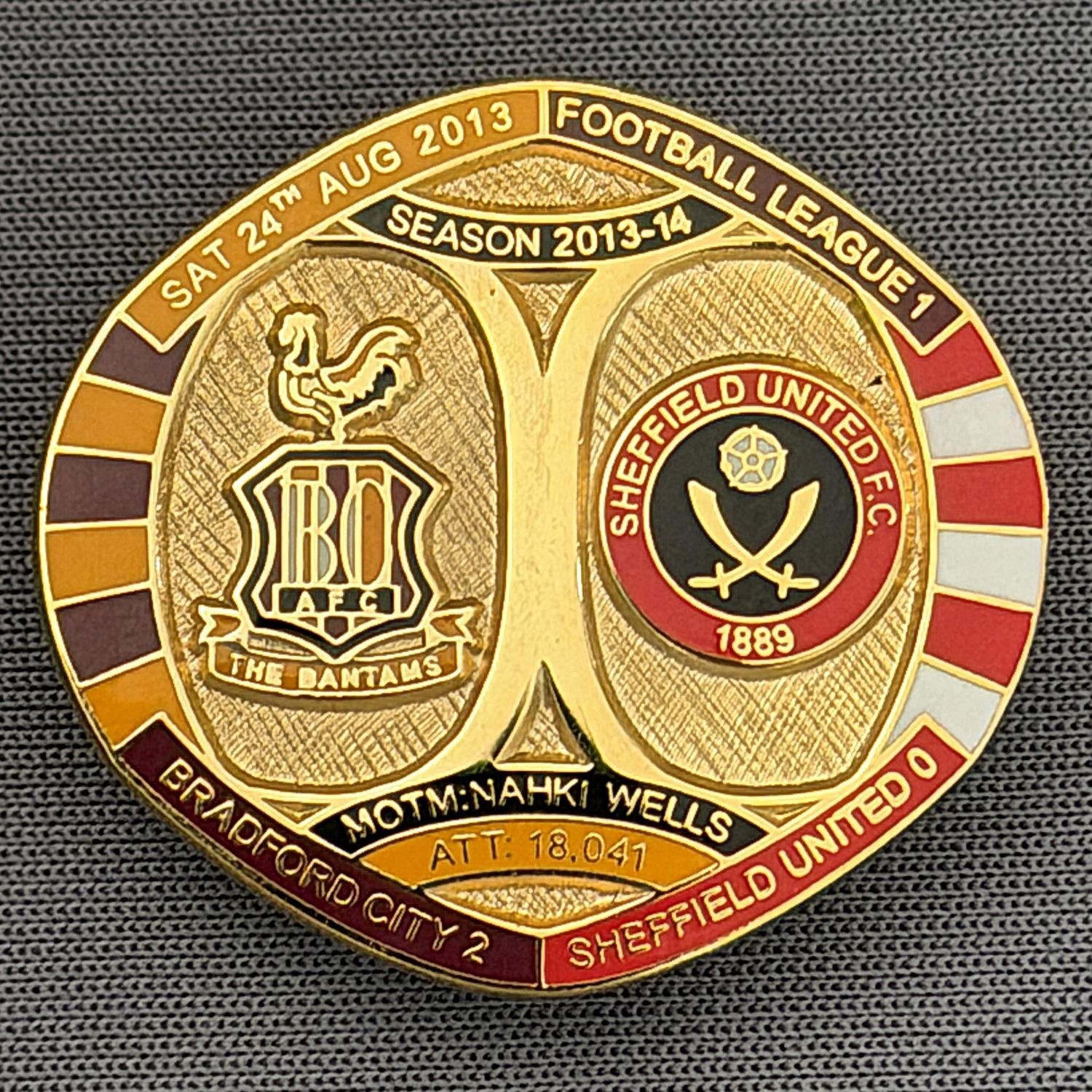 Reference Number: BCFIX186
Size: H 26.3 mm x W 28.9 mm
Pin Type: Brooch Pin
Plating: Gold
Value: £8
Manufacturer: Bradford City Badges
Comments: Bradford City v Sheffield United United 2013/14 Limited Edition 55 Badges