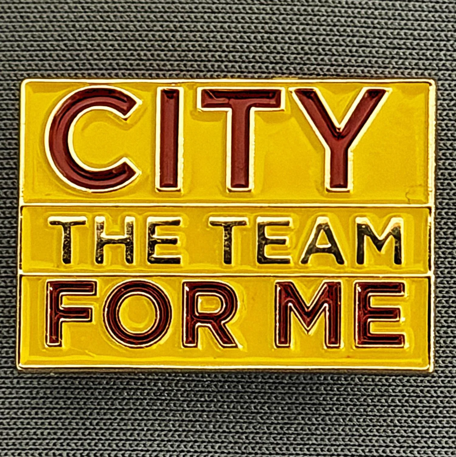 Reference Number: BCBCFC065
Size: H 17.1 mm x W 24.3 mm
Pin Type: Metal Clutch
Plating: Gold
Value: £4
Manufacturer: Unknown
Comments: Amber & Claret City The Team For Me