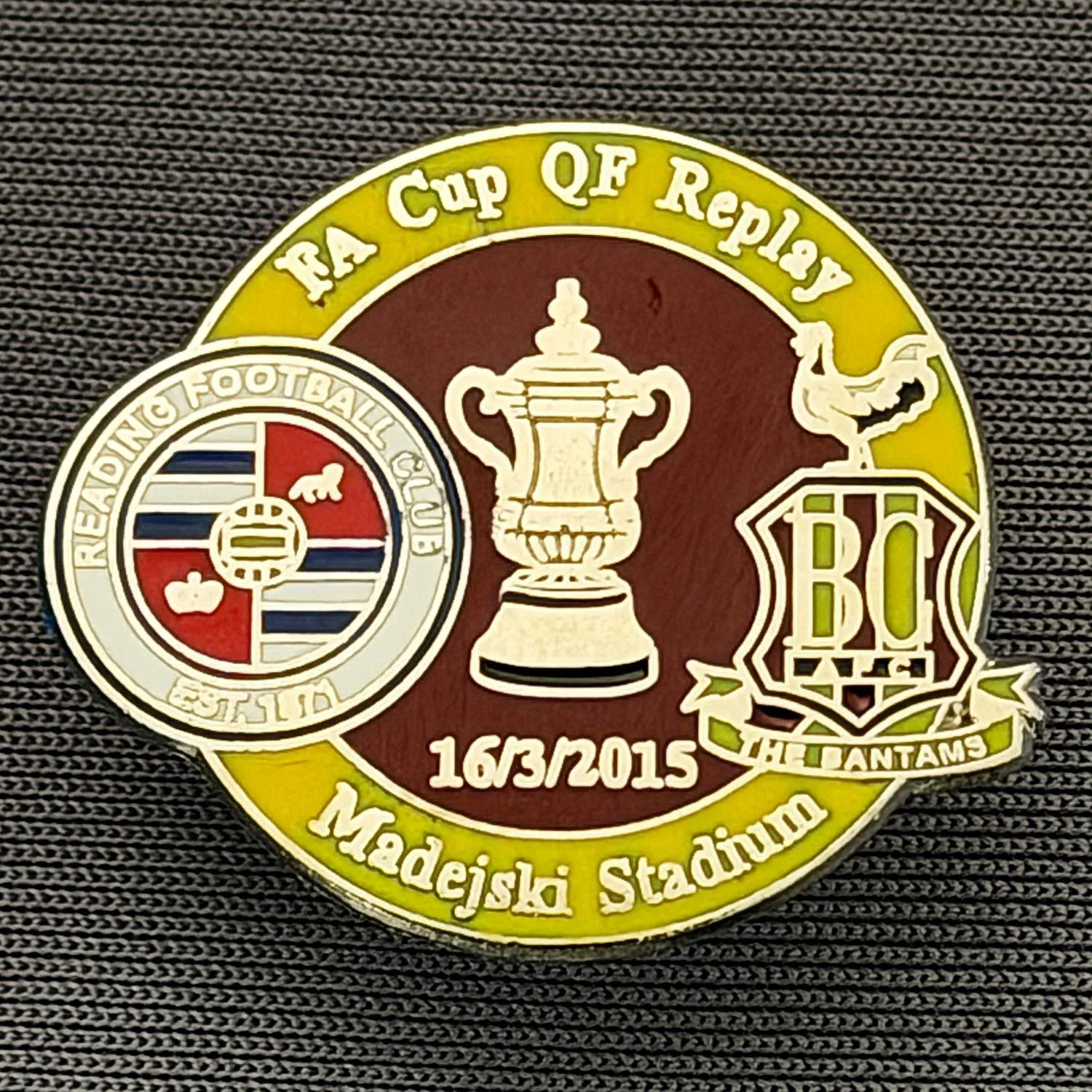 Reference Number: BCFAC123
Size: H 21.9 mm x W 26 mm
Pin Type: Metal Clutch
Plating: Silver
Value: £4
Manufacturer: Dan Lloyd
Comments: F.A. Cup Quarter Final Replay 2014/15, Away v Reading, Amber & Claret Version