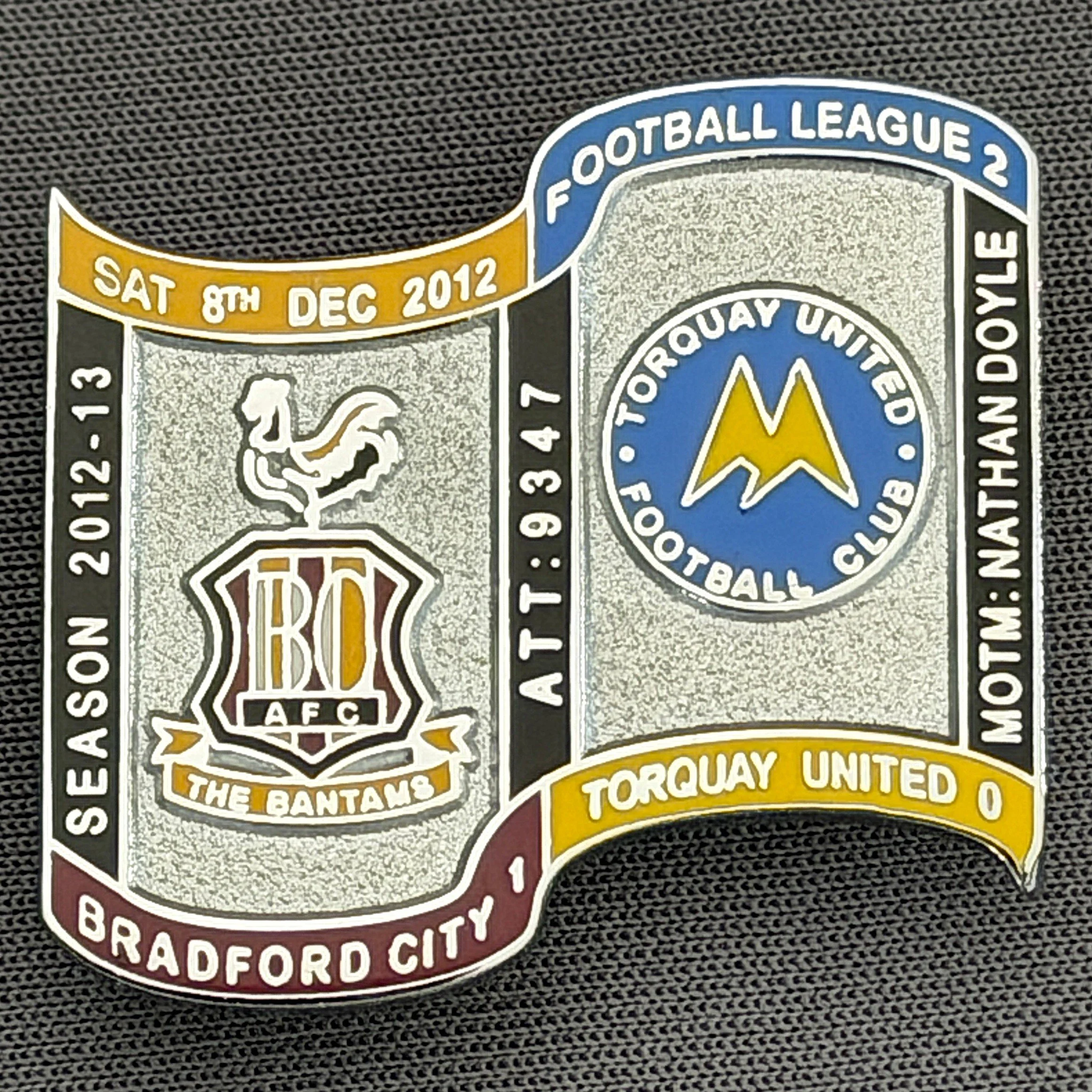 Reference Number: BCFIX149
Size: H 26.9 mm x W 29.2 mm
Pin Type: Brooch Pin
Plating: Chrome
Value: £10
Manufacturer: Bradford City Badges
Comments: Bradford City v Torquay United  2012/13 Limited Edition 10 Badges (Silver Version)