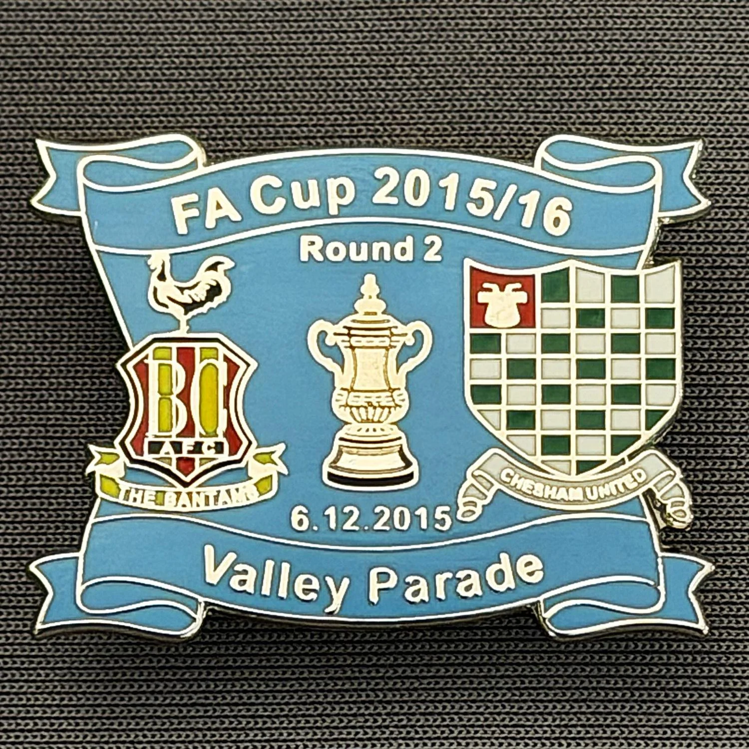 Reference Number: BCFAC148
Size: H 24.5 mm x W 32.5 mm
Pin Type: Metal Clutch
Plating: Silver
Value: £4
Manufacturer: Dan Lloyd
Comments: F.A. Cup Second Round 2015/16 v Chesham United, Blue Version