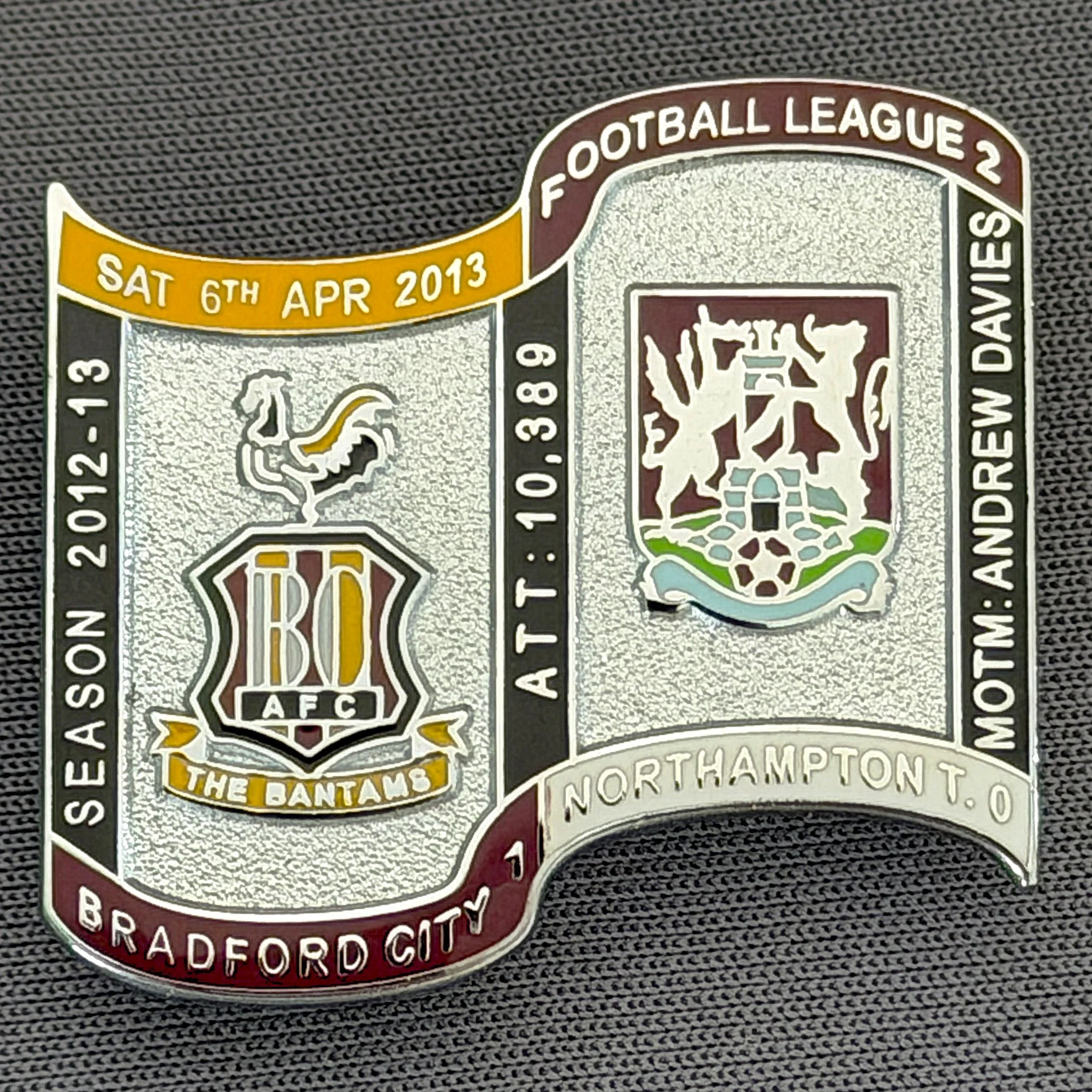 Reference Number: BCFIX158
Size: H 26.9 mm x W 29.2 mm
Pin Type: Brooch Pin
Plating: Chrome
Value: £10
Manufacturer: Bradford City Badges
Comments: Bradford City v Northampton Town 2012/13 Limited Edition 10 Badges (Silver Version)