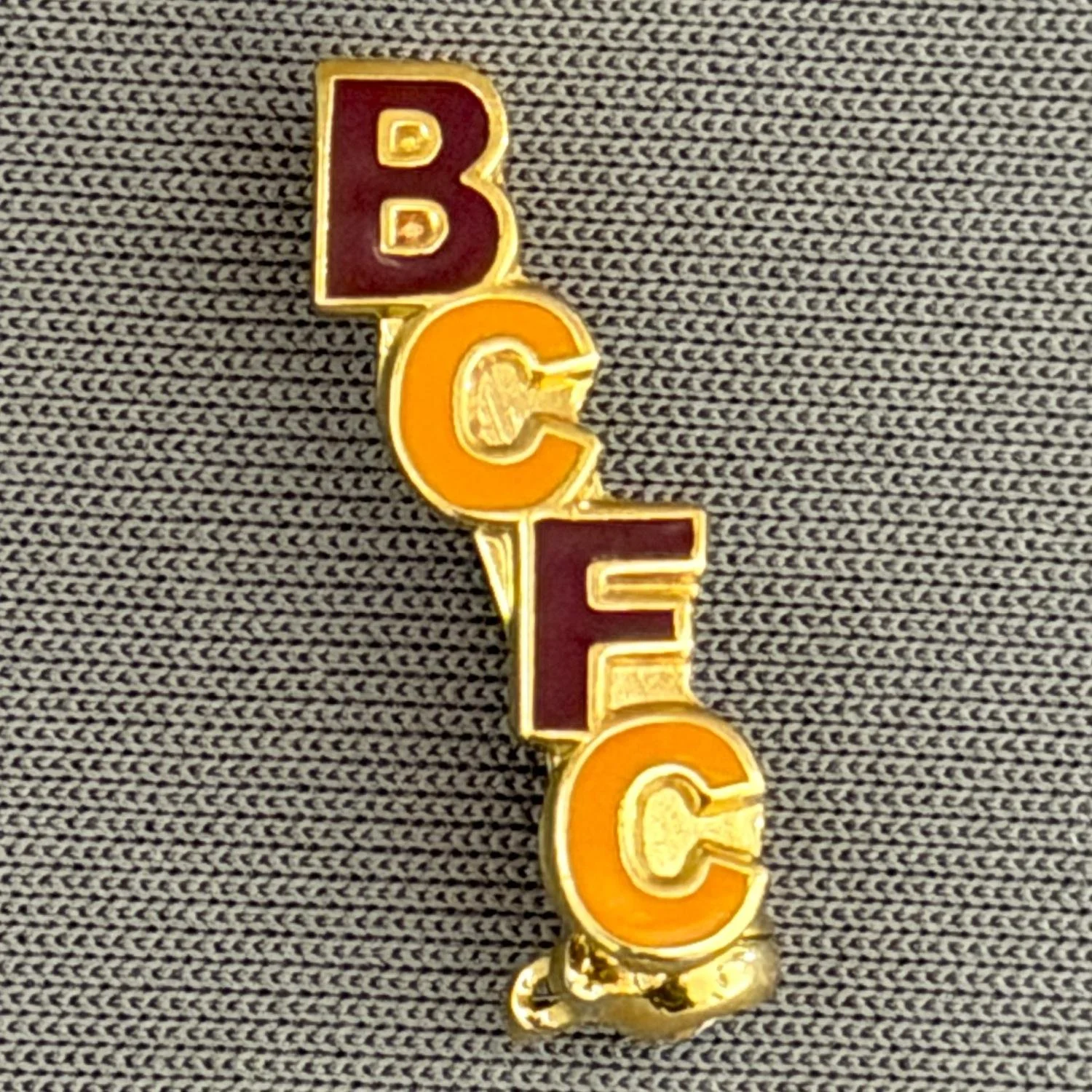 Reference Number: BCBCFC032
Size: H 18.7 mm x W 9.1 mm
Pin Type: Brooch Pin
Plating: Gold
Value: £6
Manufacturer: Unknown
Comments: BCFC Claret & Amber Version